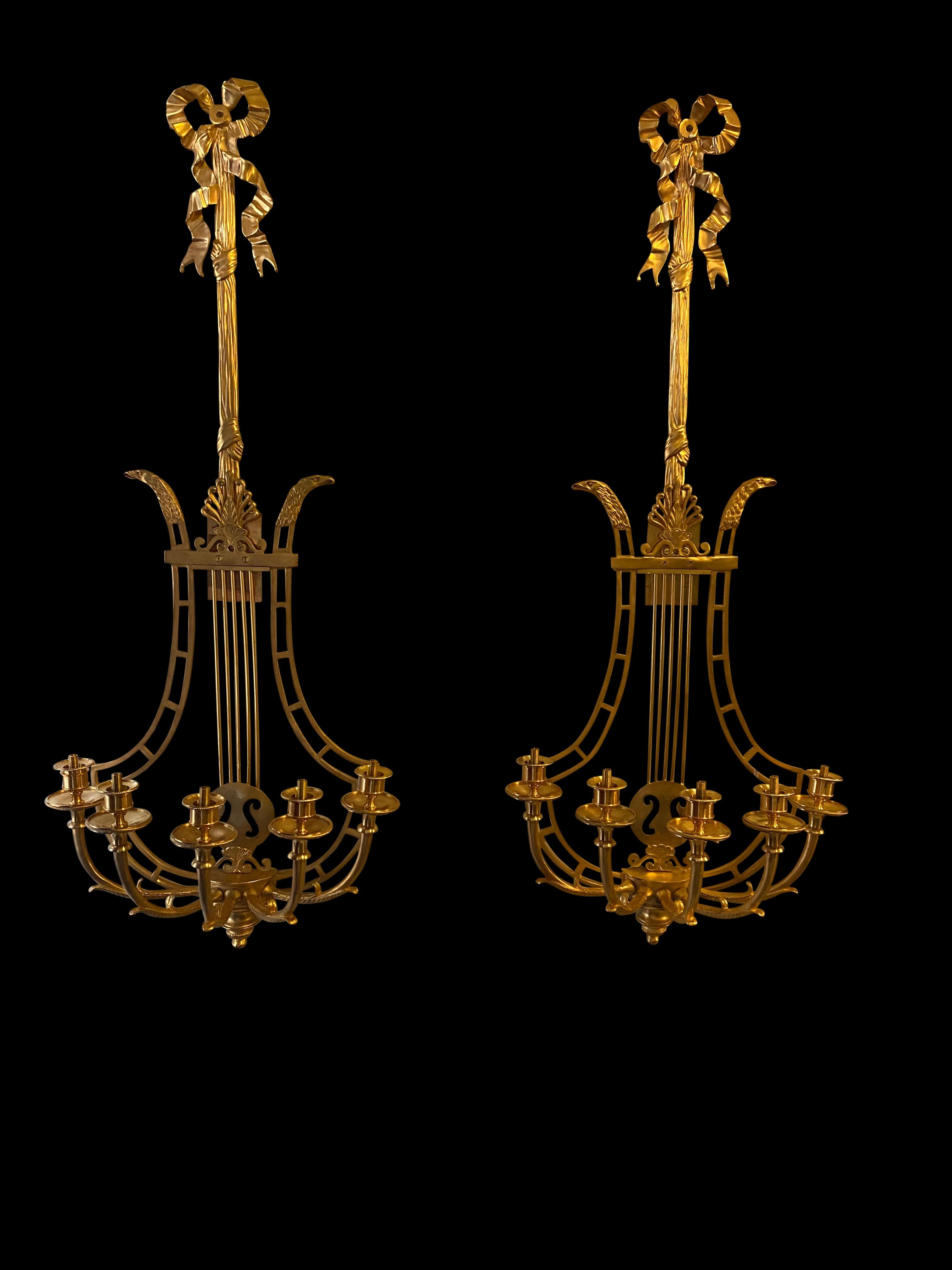 Empire sconces, French ormolu wall light candelabras Lyre, 20th century. Taking the form of a lyre, these really would add style to any room or interior. Good size at over three feet tall - 93 CM. Long hanging surmounted by ribbon.