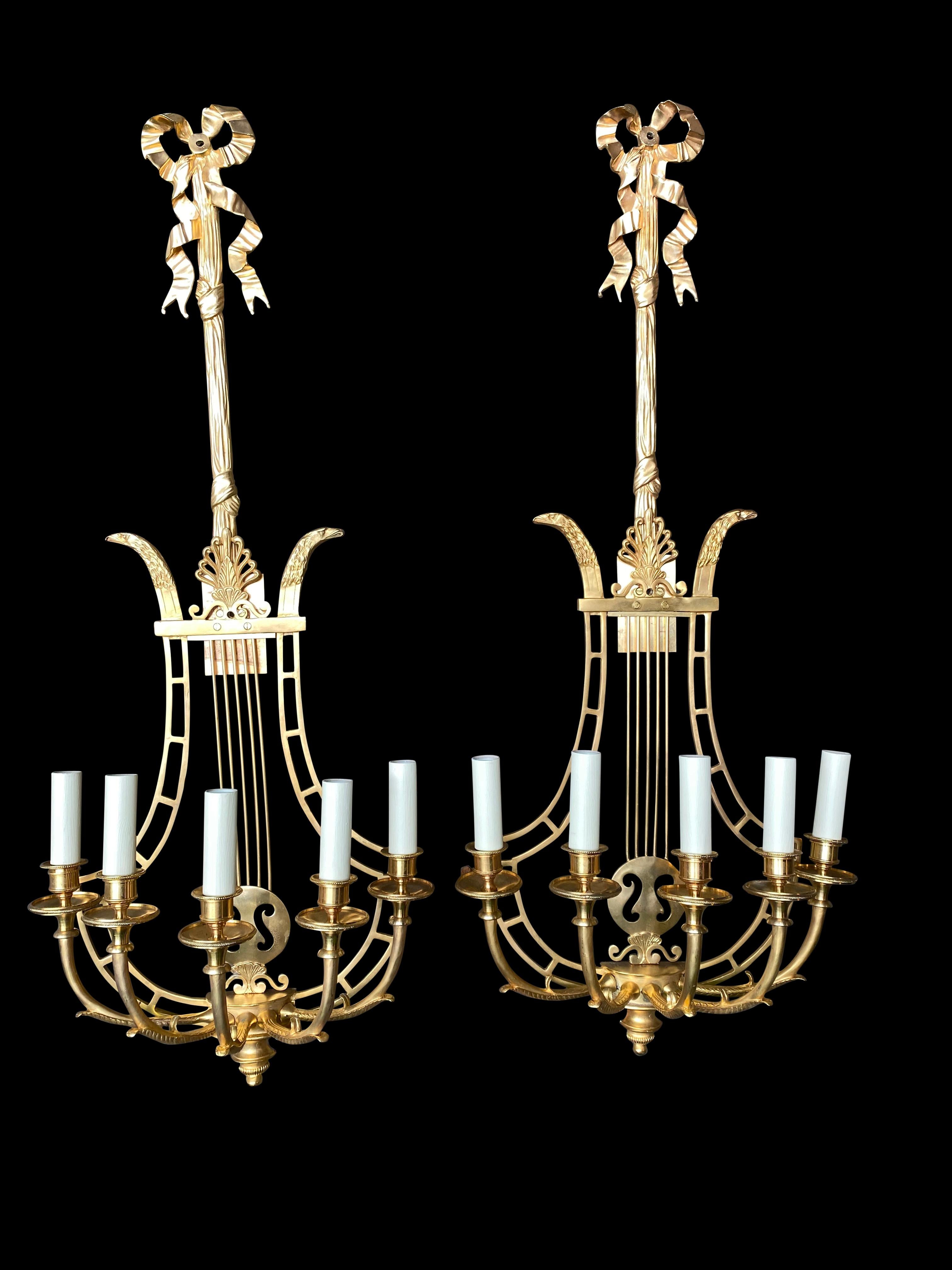 Empire sconces, French ormolu wall light candelabras Lyre, 20th century. Taking the form of a lyre, these really would add style to any room or interior. Good size at over three feet tall - 93 CM. Long hanging surmounted by ribbon.