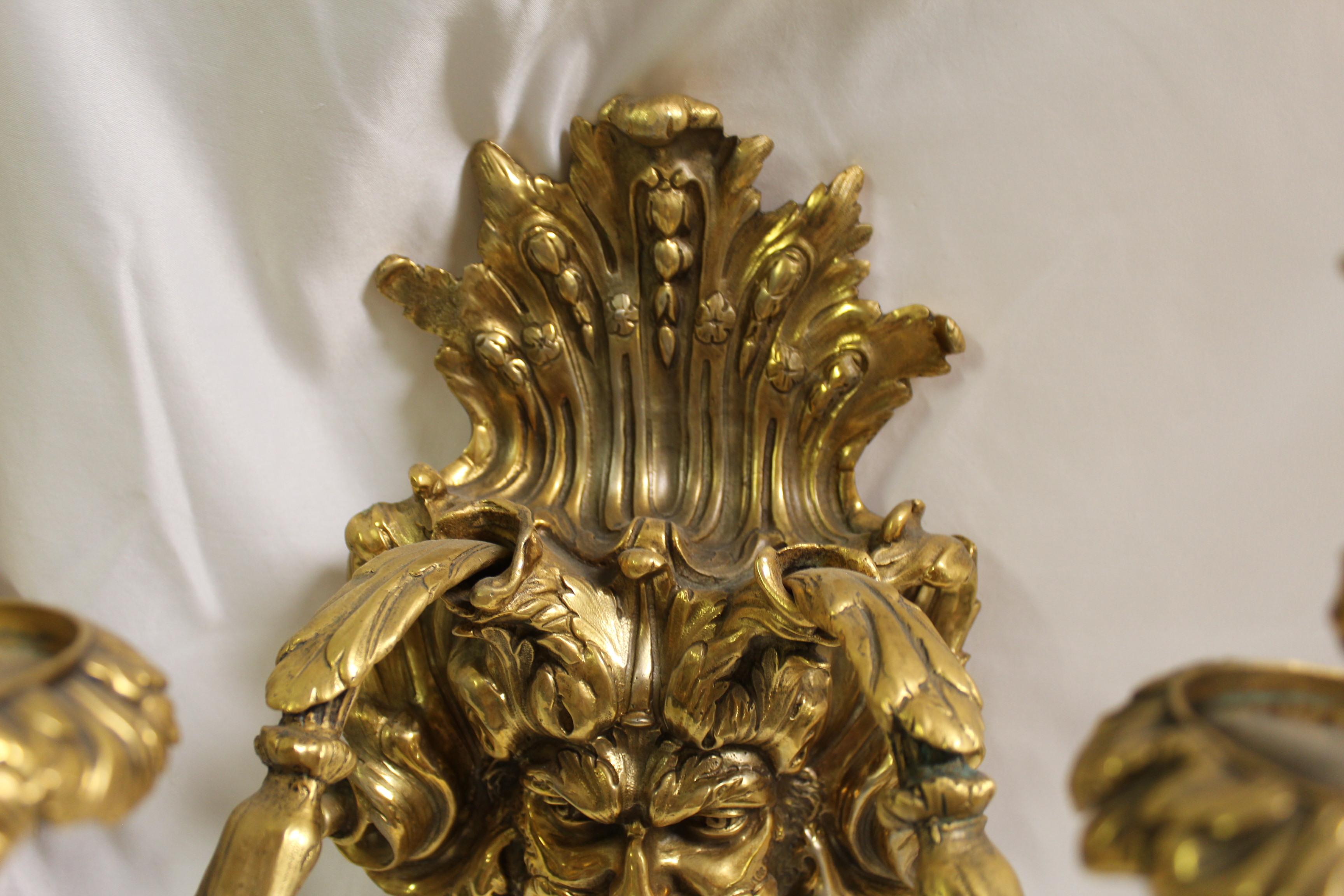 A rare find of these sconces. Came from Europe and are Contemporary cast in bronze with hi-light Gold plating finish. They are for candles and only had a hook on the back for hanging. These are the last pair around and were showroom samples never