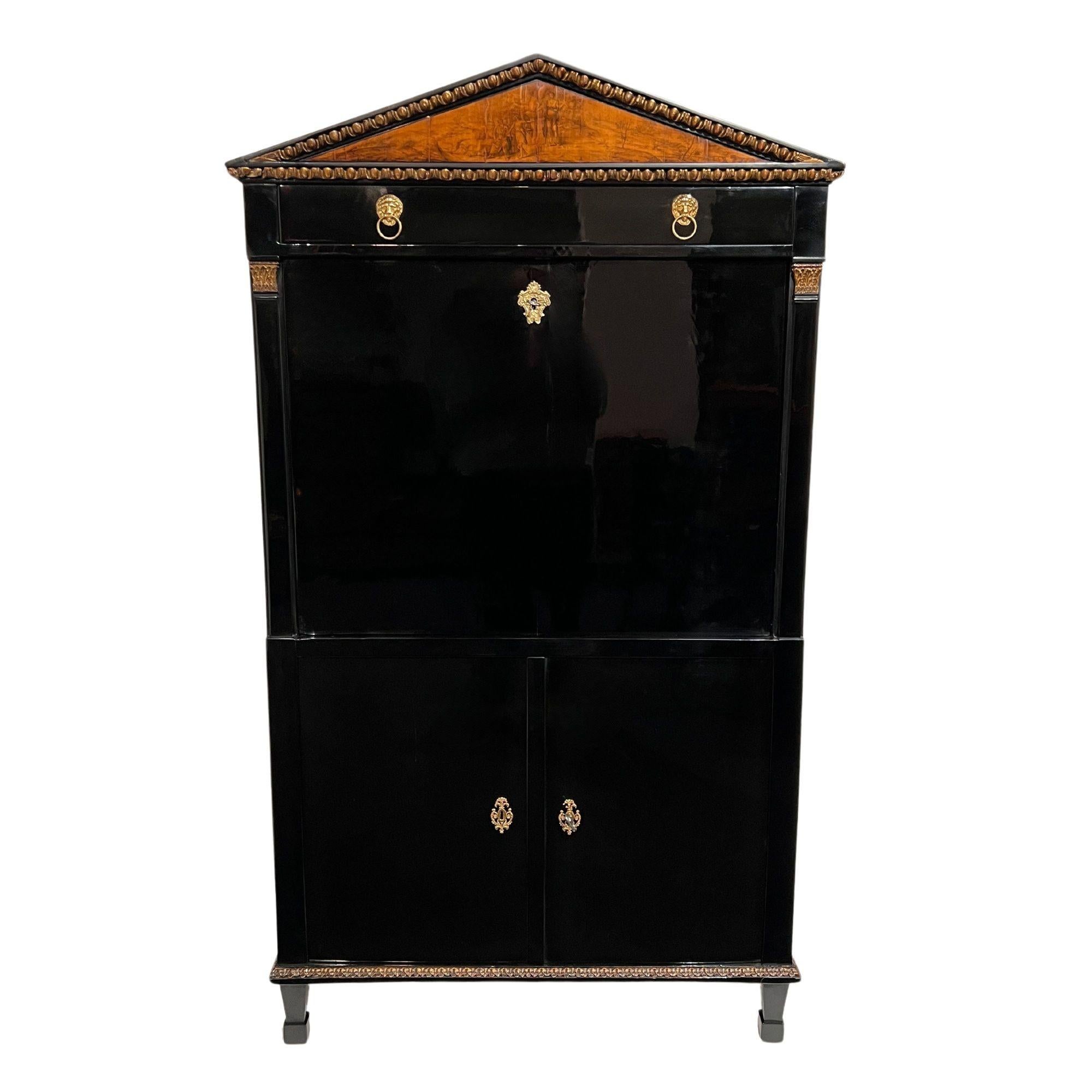 Very fine neoclassical Empire Secretaire or writing cabinet from Austria, Vienna around 1810/15.
Ebonized hardwood body, veneered on oak. Pilaster columns with gilded capitals. All gilding original and patinated.
Classicist gable cornice with