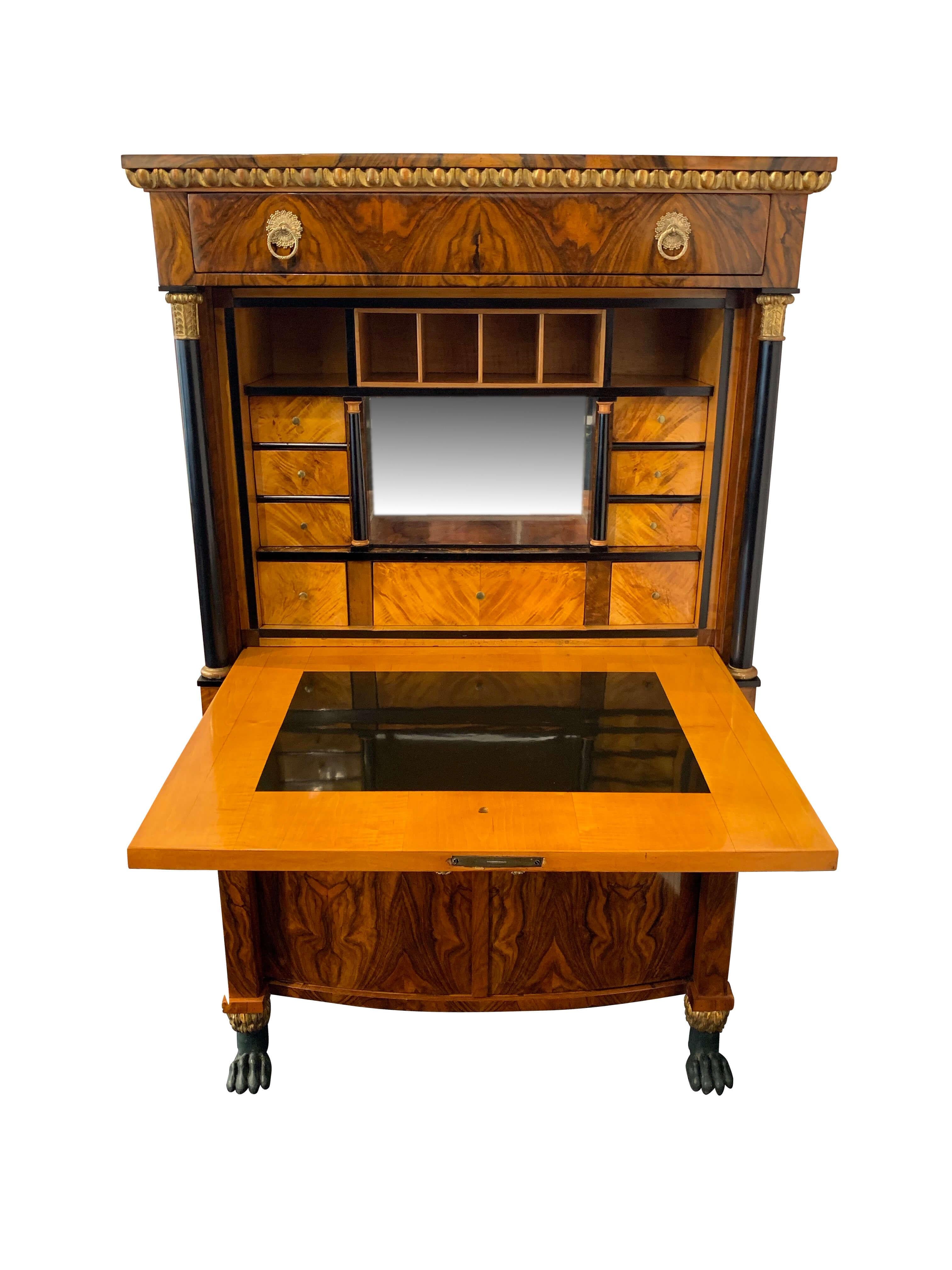 Very fine neoclassical Empire Secrétaire / Secretary / Escritoire / writing armoire from Vienna, Austria (then called Danube Monarchy), circa 1810.

Finely chosen, bookmatched walnut veneer running through overhead drawer and plate. French polished