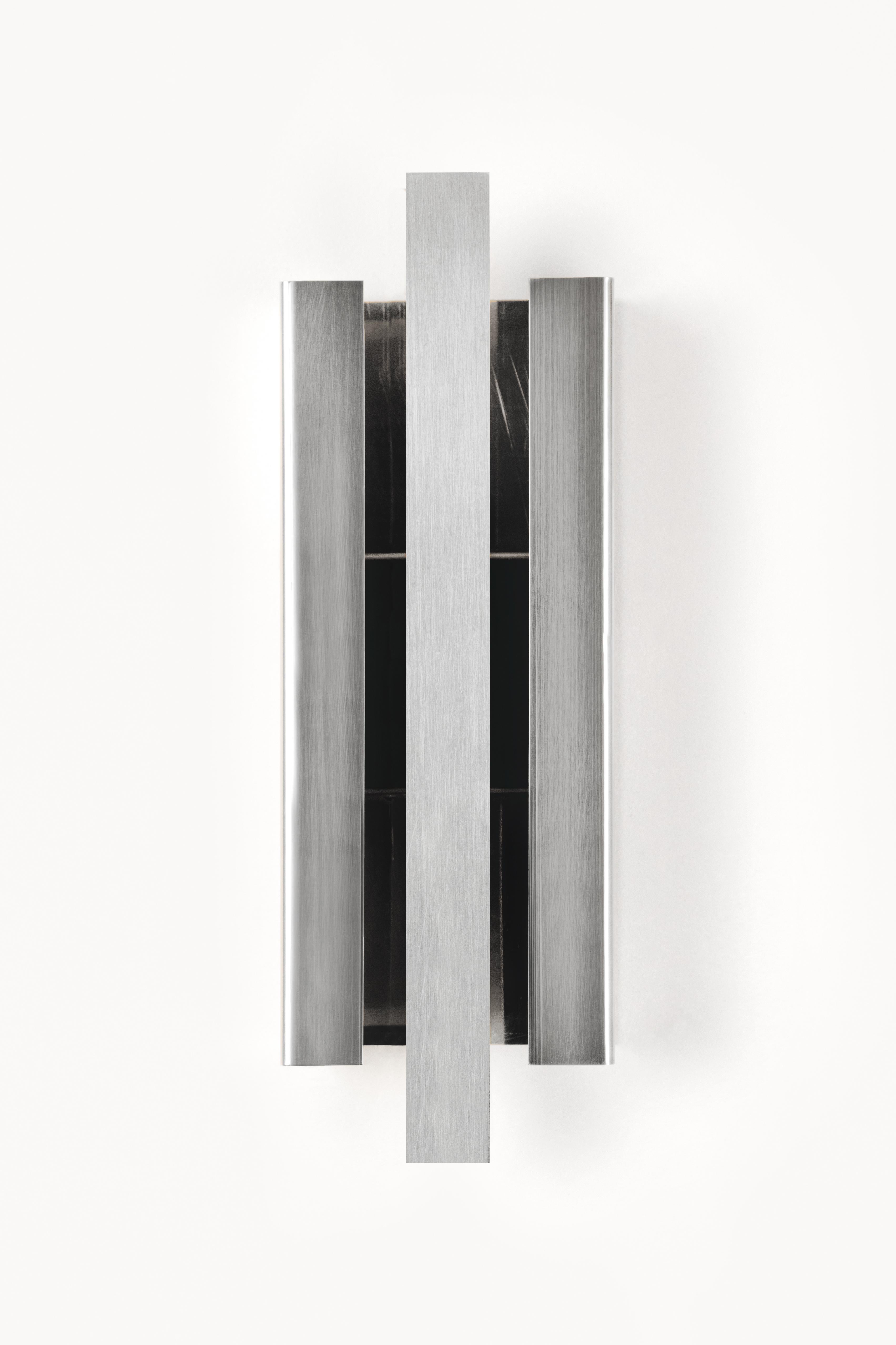 Empire Silver Light Sculpture by Marie Jeunet
Dimensions: D 8.5 x W 12 x H 35 cm
Materials: Brushed aluminum.


--MARIE JEUNET--
From grandparents to framers and lighting manufacturers, a childhood spent next to the
workshop of a great master