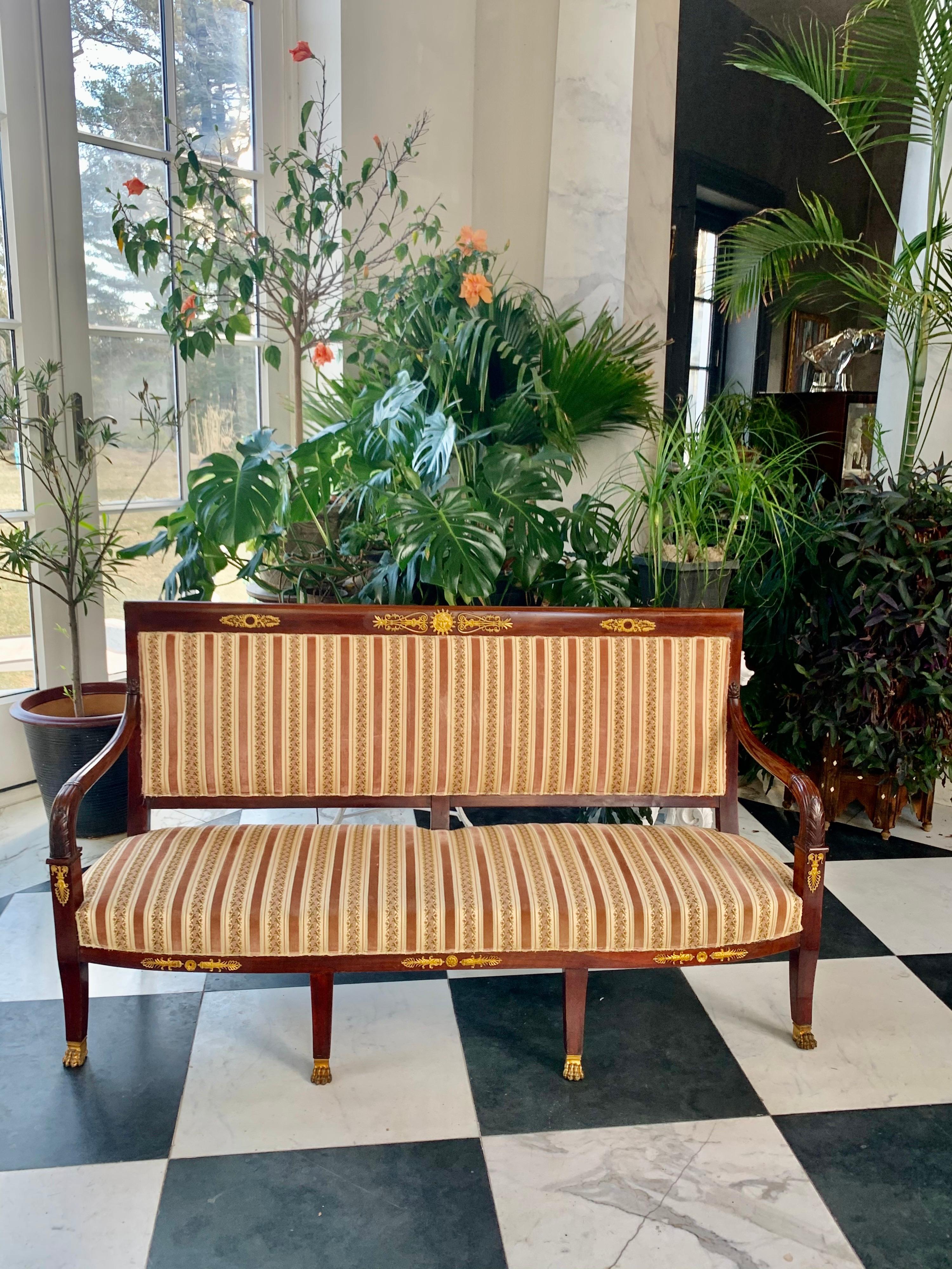 Second Empire period mahogany sofa with original ormolu mounts including the paw feet. 
Note: The fabric is in decent condition, but should be reupholstered.