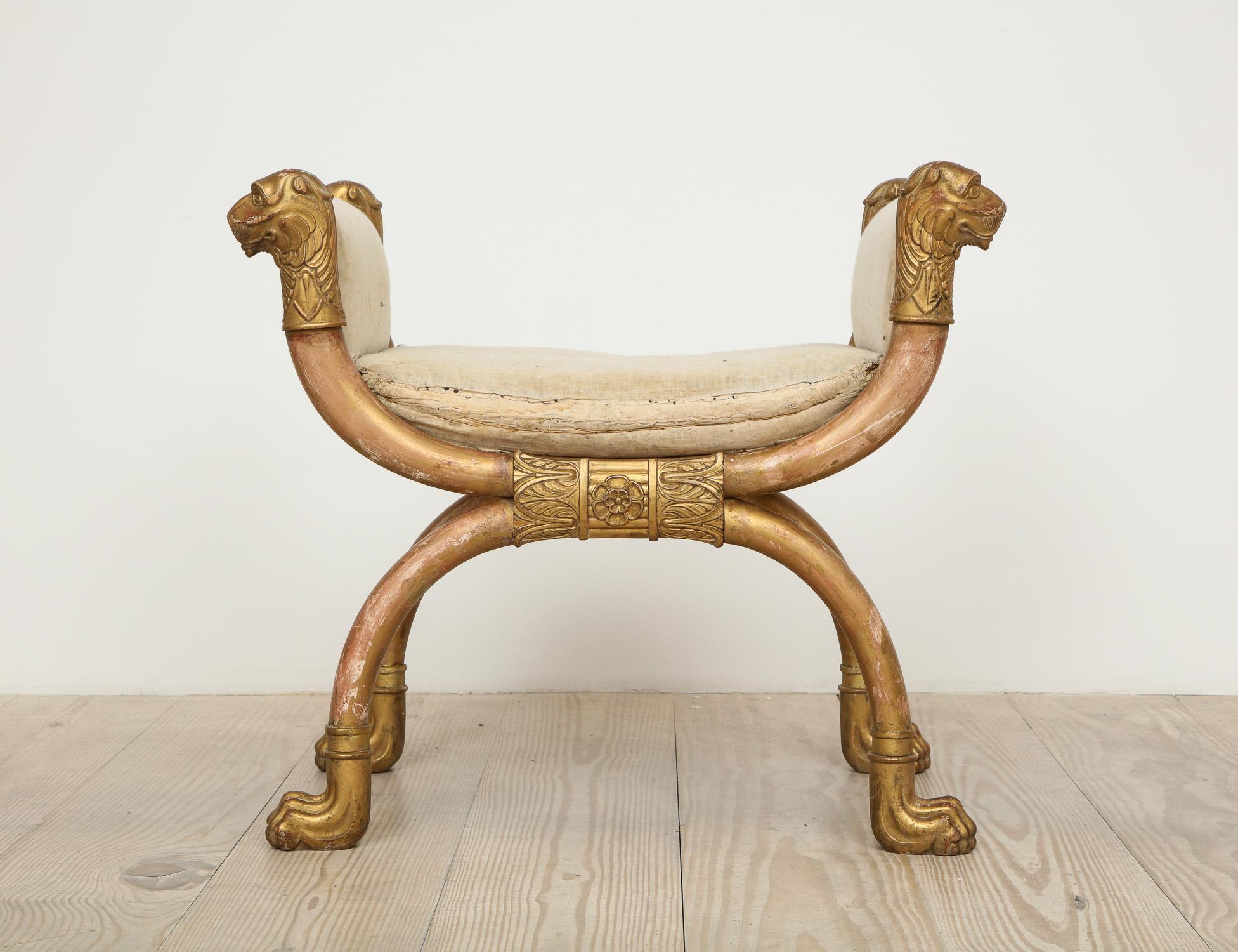 Fantastic Swedish Empire stool with giltwood lion heads and paw feet, Sweden, circa 1810.

Featured in our gallery windows (photographs attached) photographed by David Prince and Jill Dienst.
 