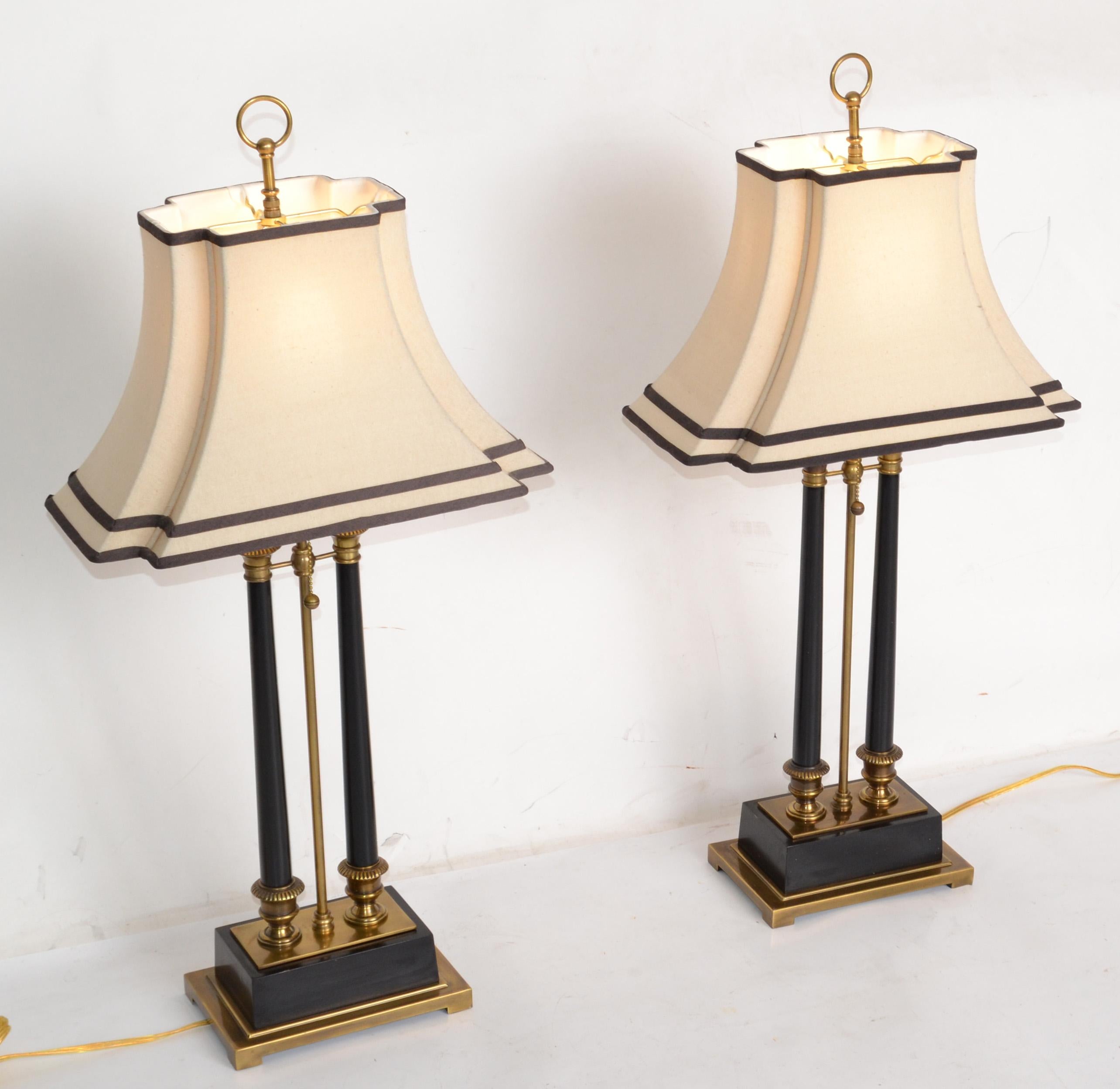 A pair of Mid-Century Modern Empire Style big scale brass and ebonized wood rectangular solid brass table lamps.
The Pair comes with Harps, matching finials, shades and are heavy.
In perfect working condition, UL Listed and each uses a max. 100