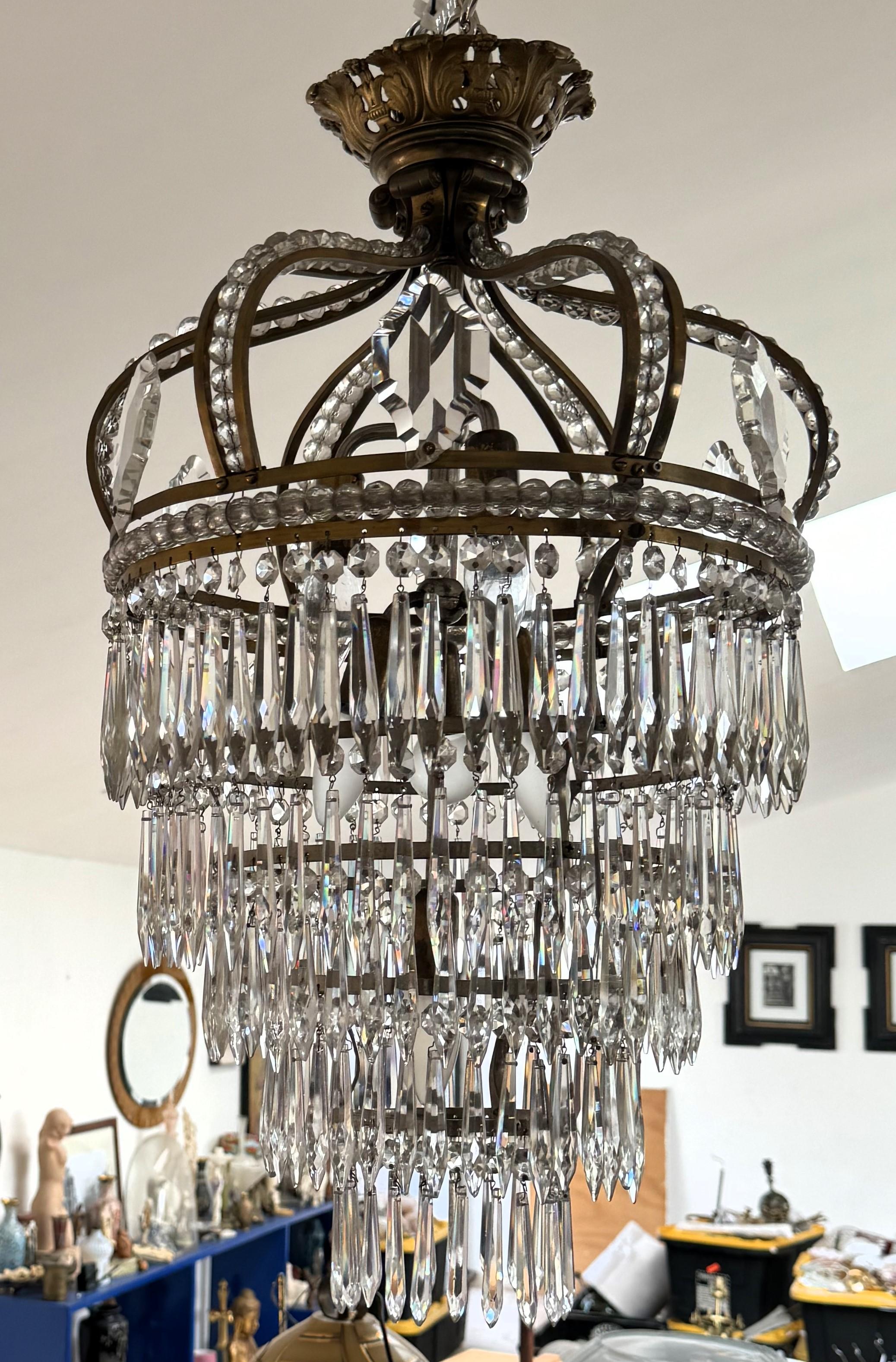 Beautiful Chandelier depicting what appears  to be a glass waterfall coming out of a 
