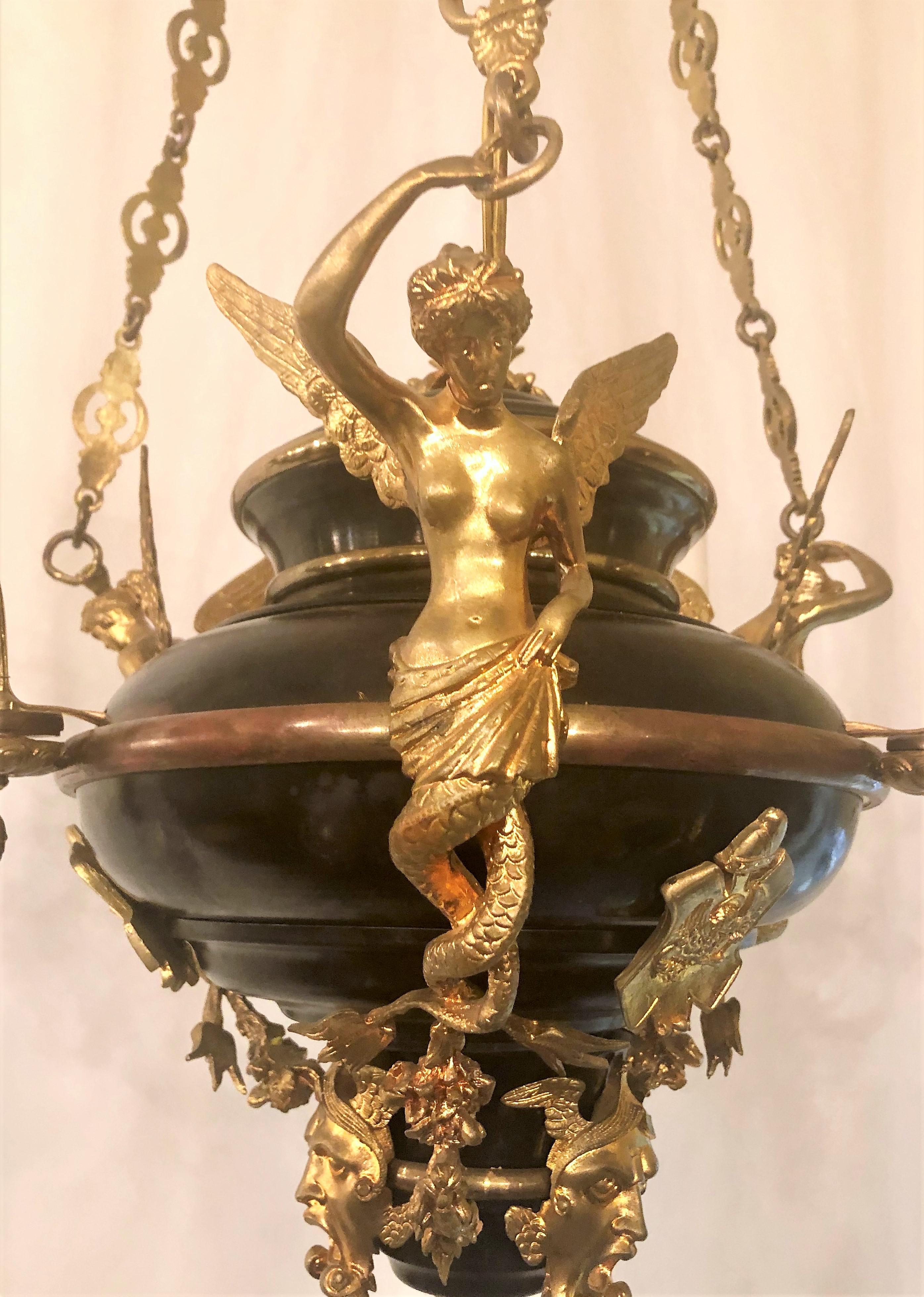 Empire style bronze chandelier with fine detailing.