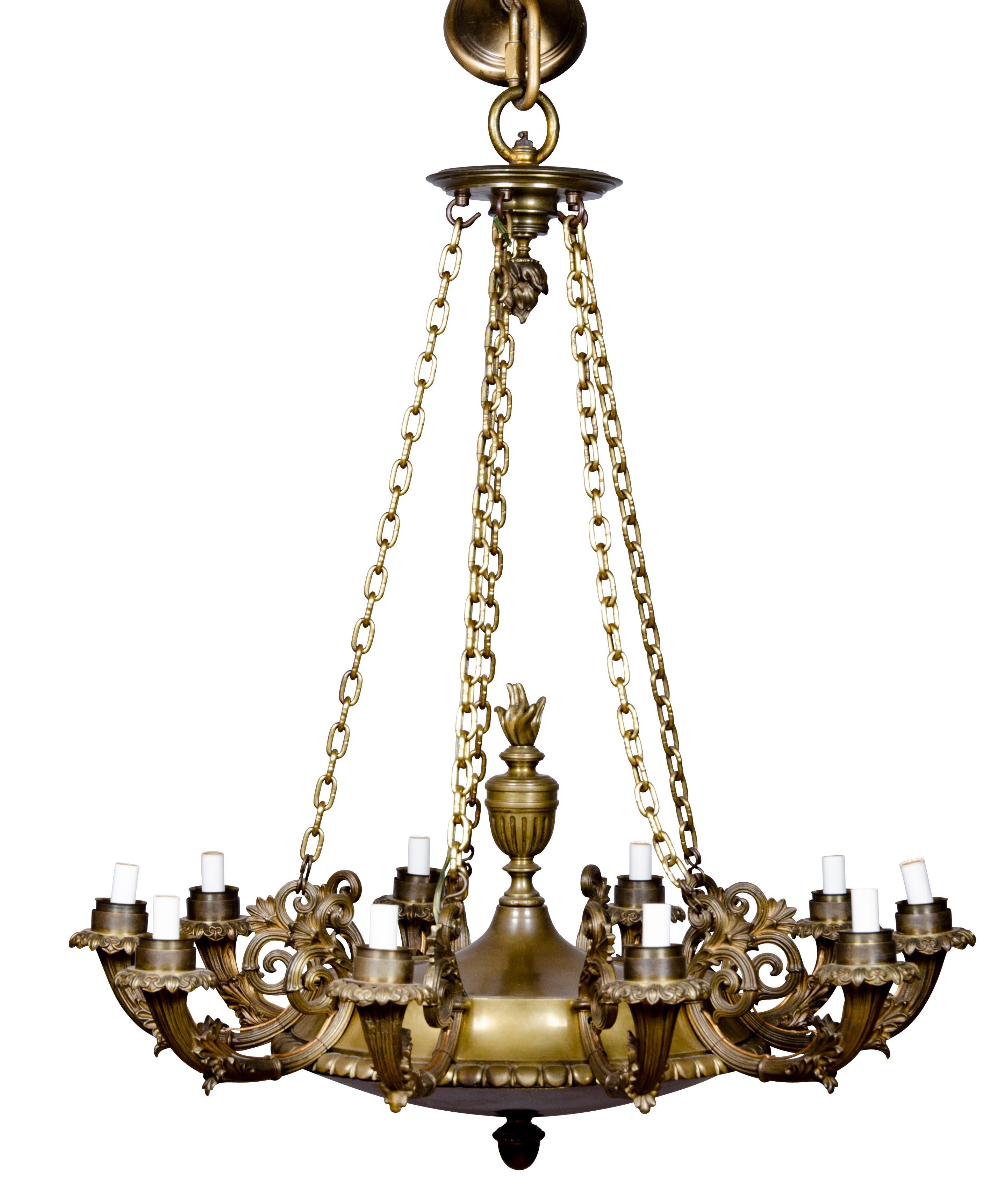 Ten arms with suspended chains. Electrified. Heavy gauge bronze. Possibly Caldwell. From a Sutton Place NY townhouse.