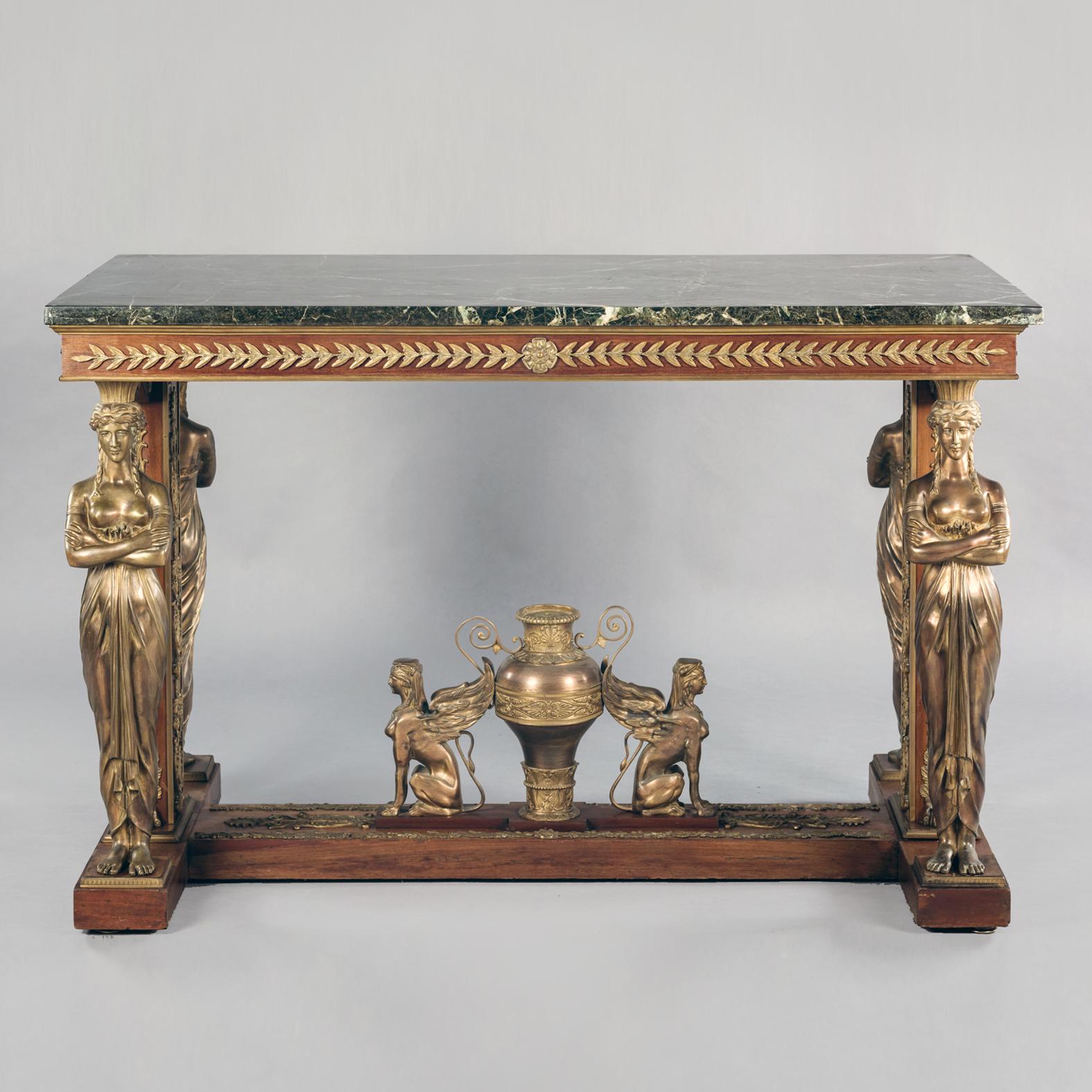 A fine Empire style gilt-bronze mounted mahogany centre table with a Vert de Mer marble top, in the manner of Jacob-Desmalter. 

The rectangular Verde Antico marble top sits above a frieze applied with laurel leaves, supported by two gilt-bronze