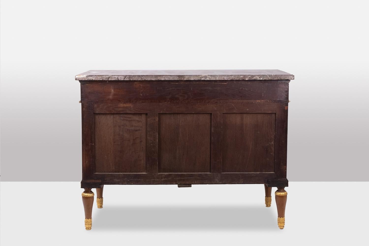19th Century Empire style chest of drawers in lacquer, bronze and marble. Nineteenth century.