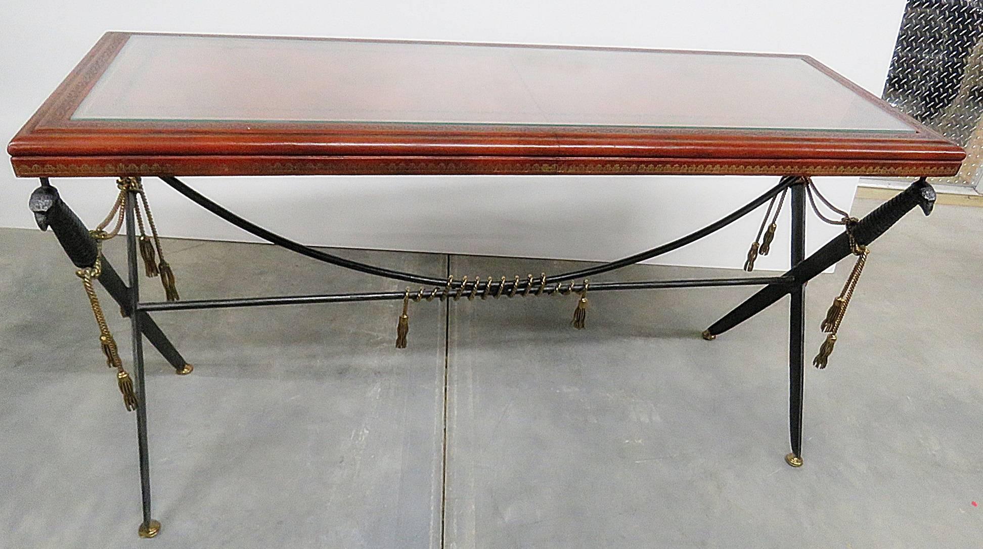 Empire style console table with glass over leather top.
