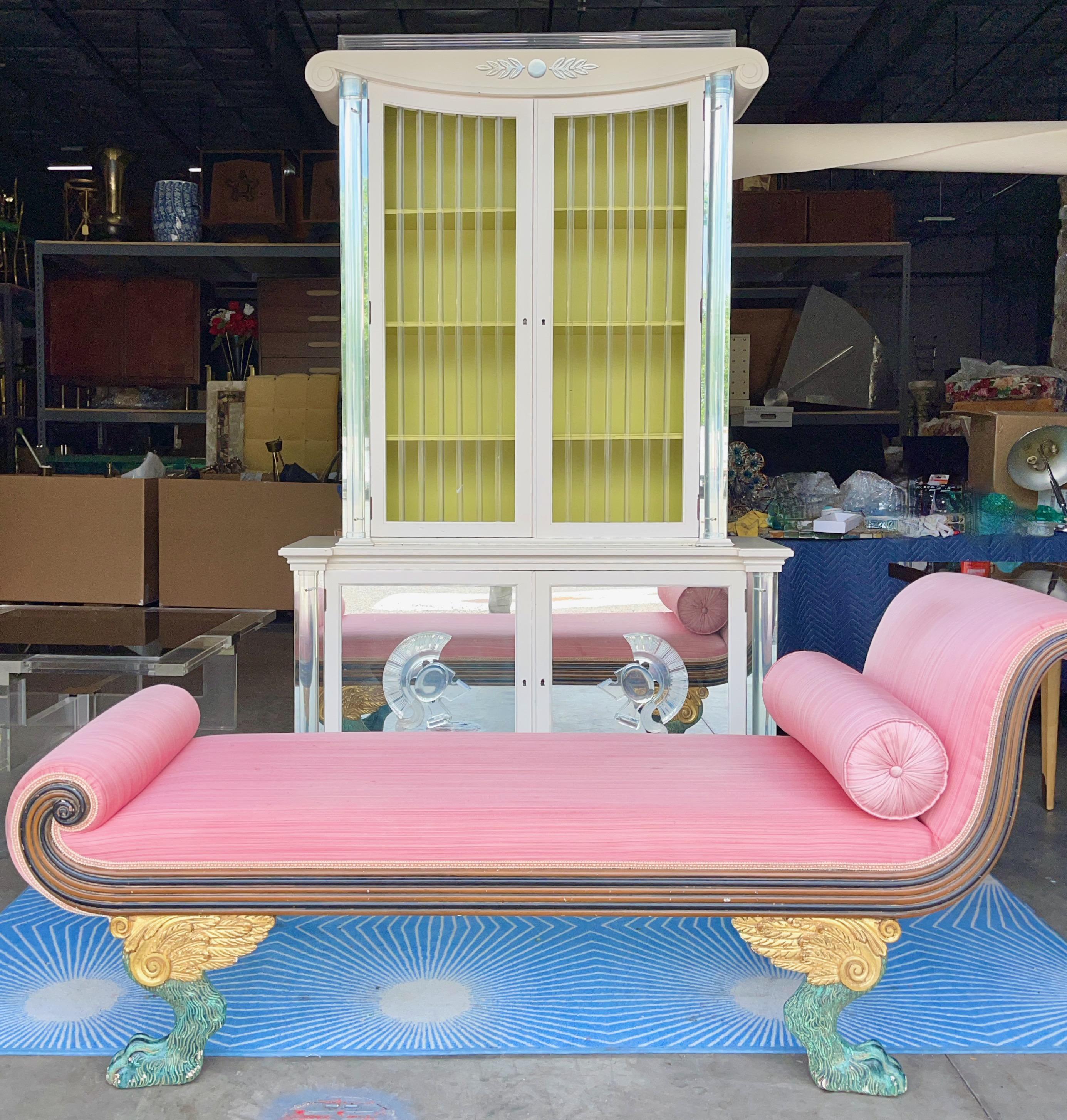 Very dramatic and theatrical Empire/Regency style recamier chaise in ebonized mahogany with carved parcel-gilt and verde antique stained winged paw feet. 
Original upholstery is salmon slubbed silk.
Tallest part is 31 1/2 seat height 18, length 71,