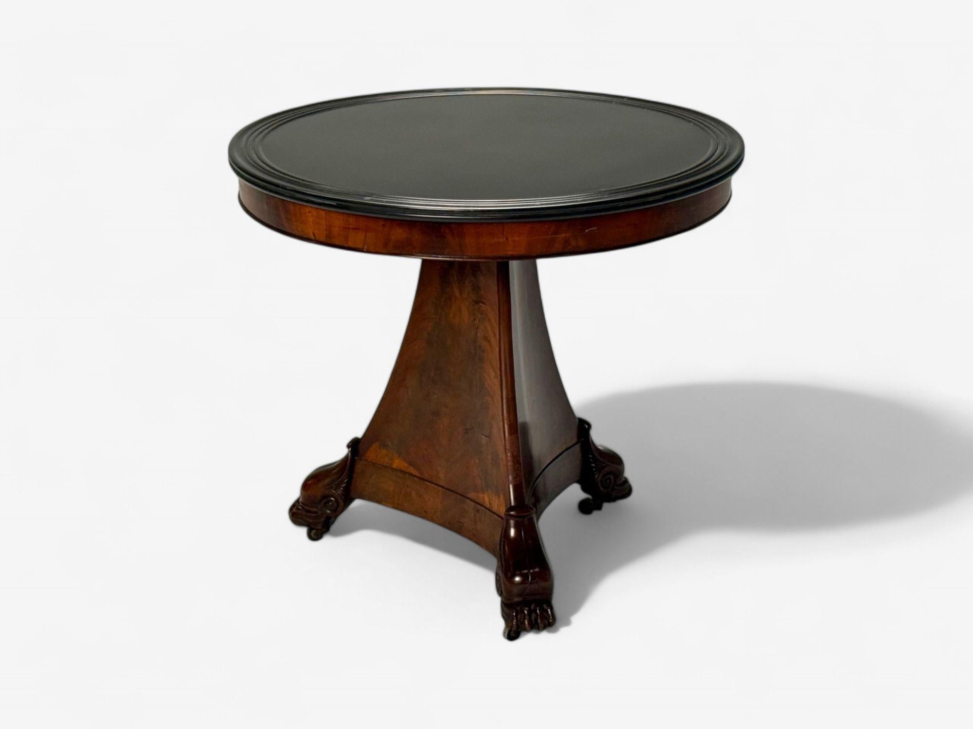 Charles X, French Empire Style, Flame Mahogany, Slate, Gueridon Table, 19th C.

A striking Charles X period Empire-style gueridon table, featuring a black slate top supported by a tripod pedestal base crafted from flame mahogany. The base is