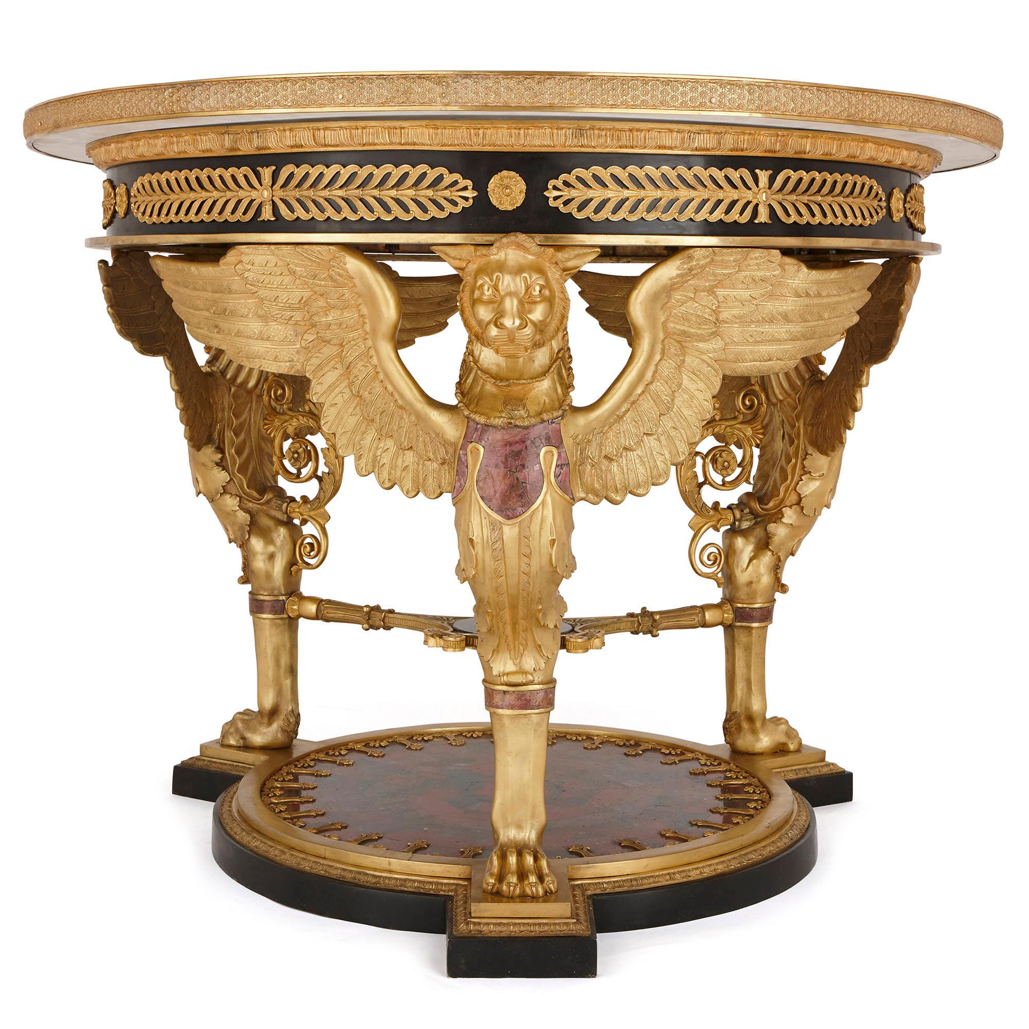 This magnificent table is designed in the Empire style, which flourished when Napoleon I was Emperor of France (1804-14). The style was a phase of Neoclassicism, which drew heavily on the art of Imperial Rome and ancient Egypt. It was characterised