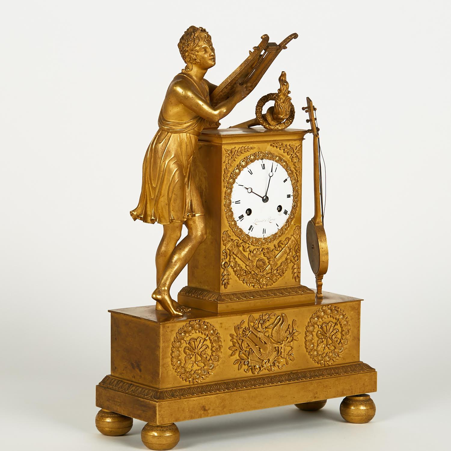 Empire Style Gilt Bronze Clock from the 19th Century. In Good Condition For Sale In Saint-Ouen, FR