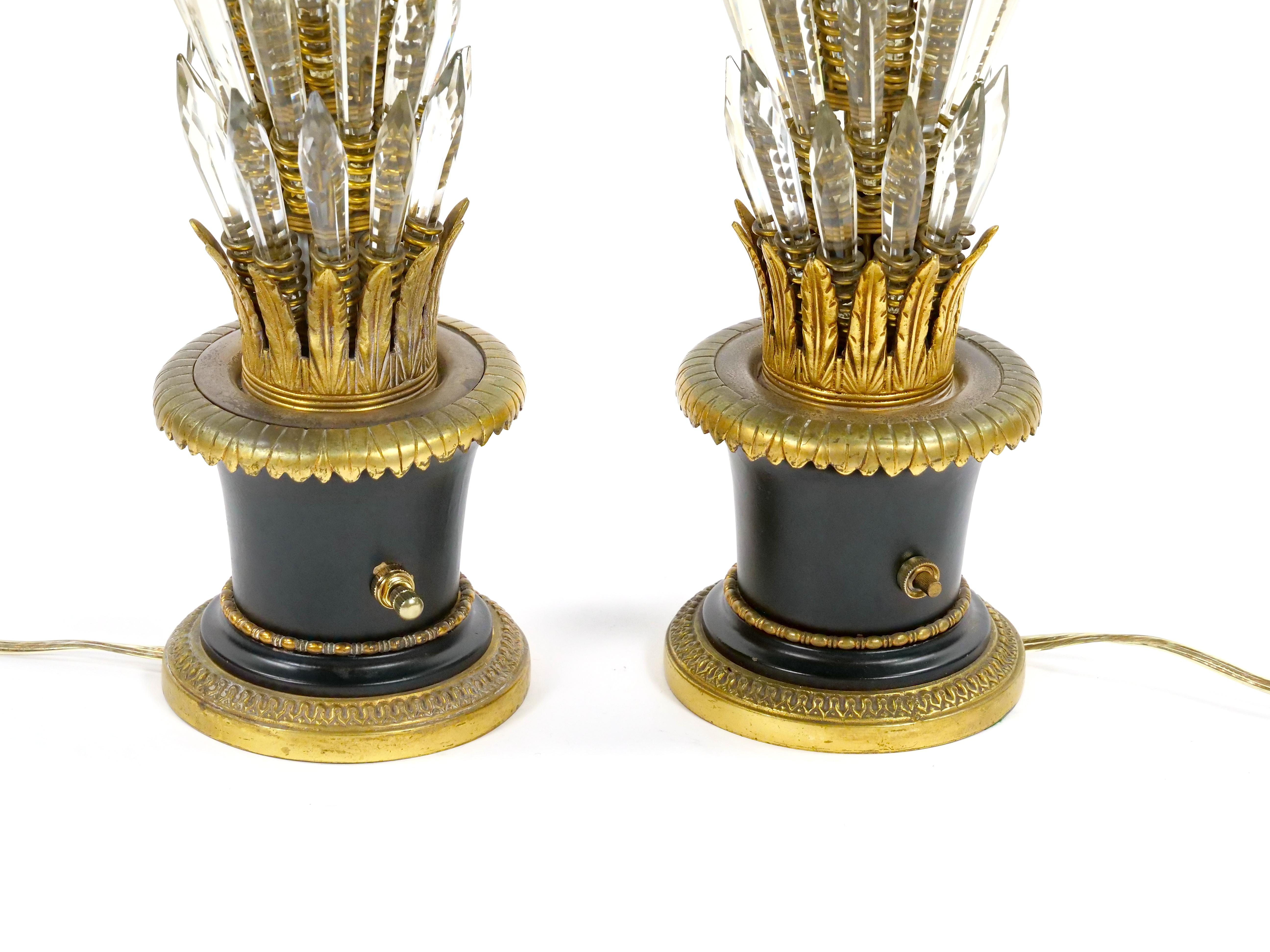 This exquisite 20th-century Empire-style table lamp showcases masterful Italian craftsmanship, featuring a striking tree-form design adorned with removable crystal leaves that beautifully catch and reflect the light. The delicate interplay between