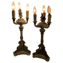 Antique Empire-style lacquered and gilded wood candlesticks from the late 1800s