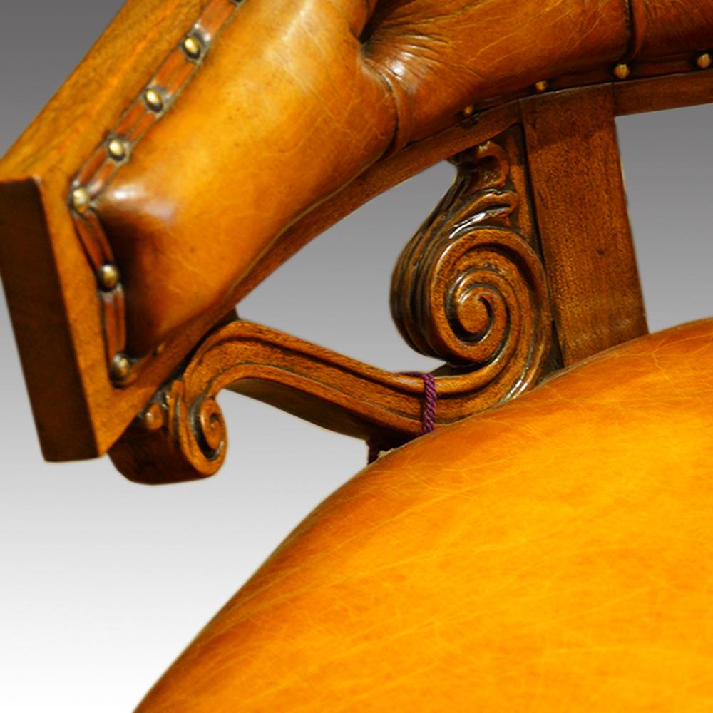 Mahogany tub shaped desk chair
This mahogany tub shaped desk chair was made circa 1920.
The horseshow shaped back with scroll carved supports.
We have upholstered this in fine hand dyed leather before finishing with our unique antique
