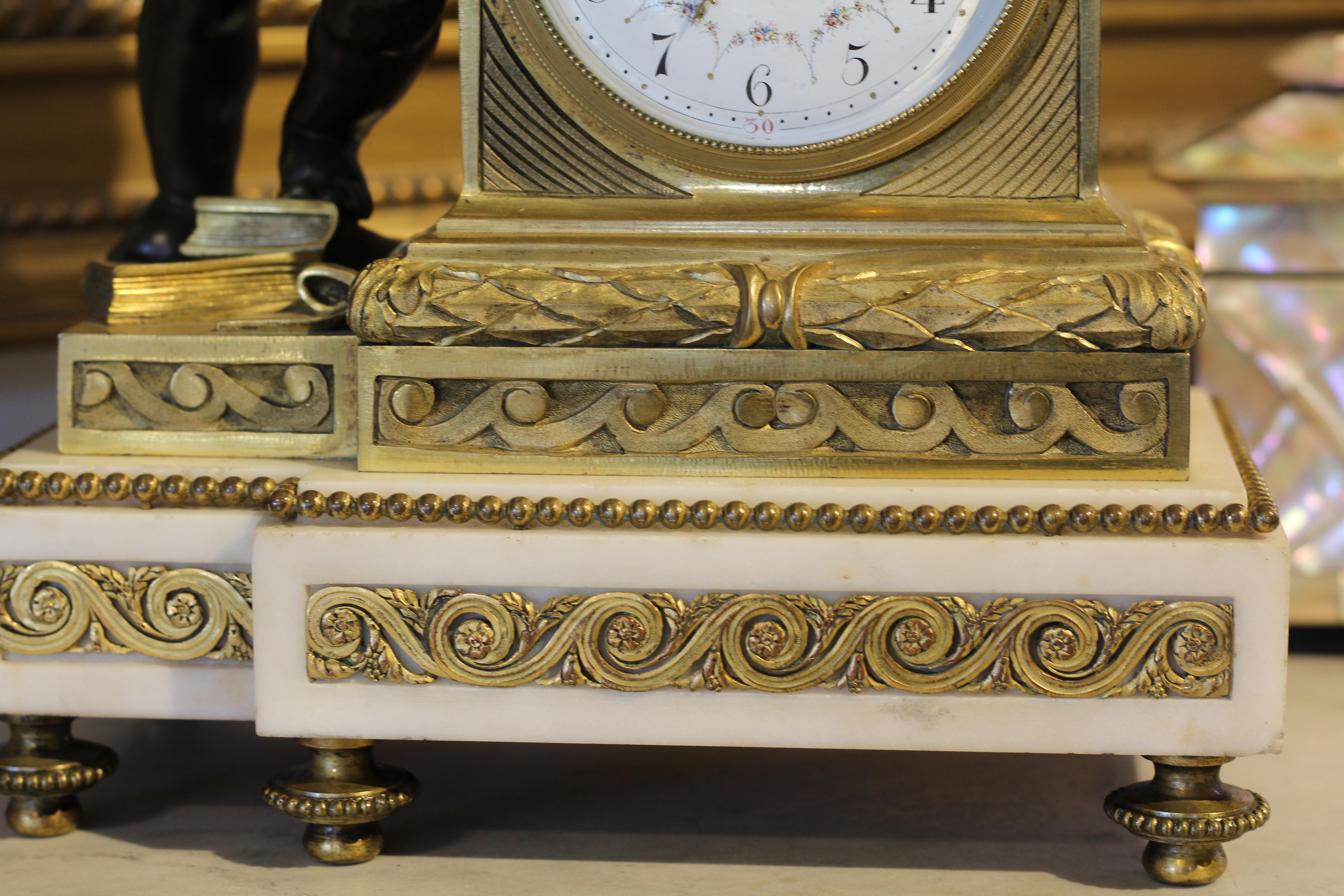 Empire style mantel (fireplace) clock with white marble base. Classical gilt bronze detail to clock and base with bronze cherub embracing a bronze rooster, 1860.