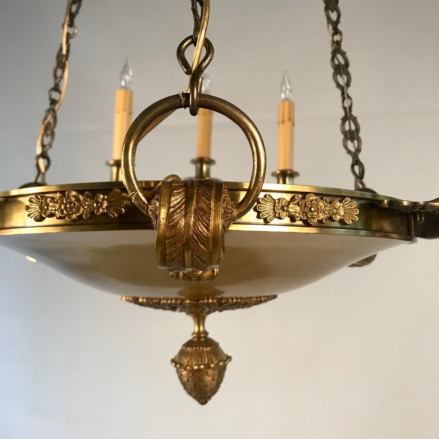 Cast Empire Style Nine Light Chandelier For Sale