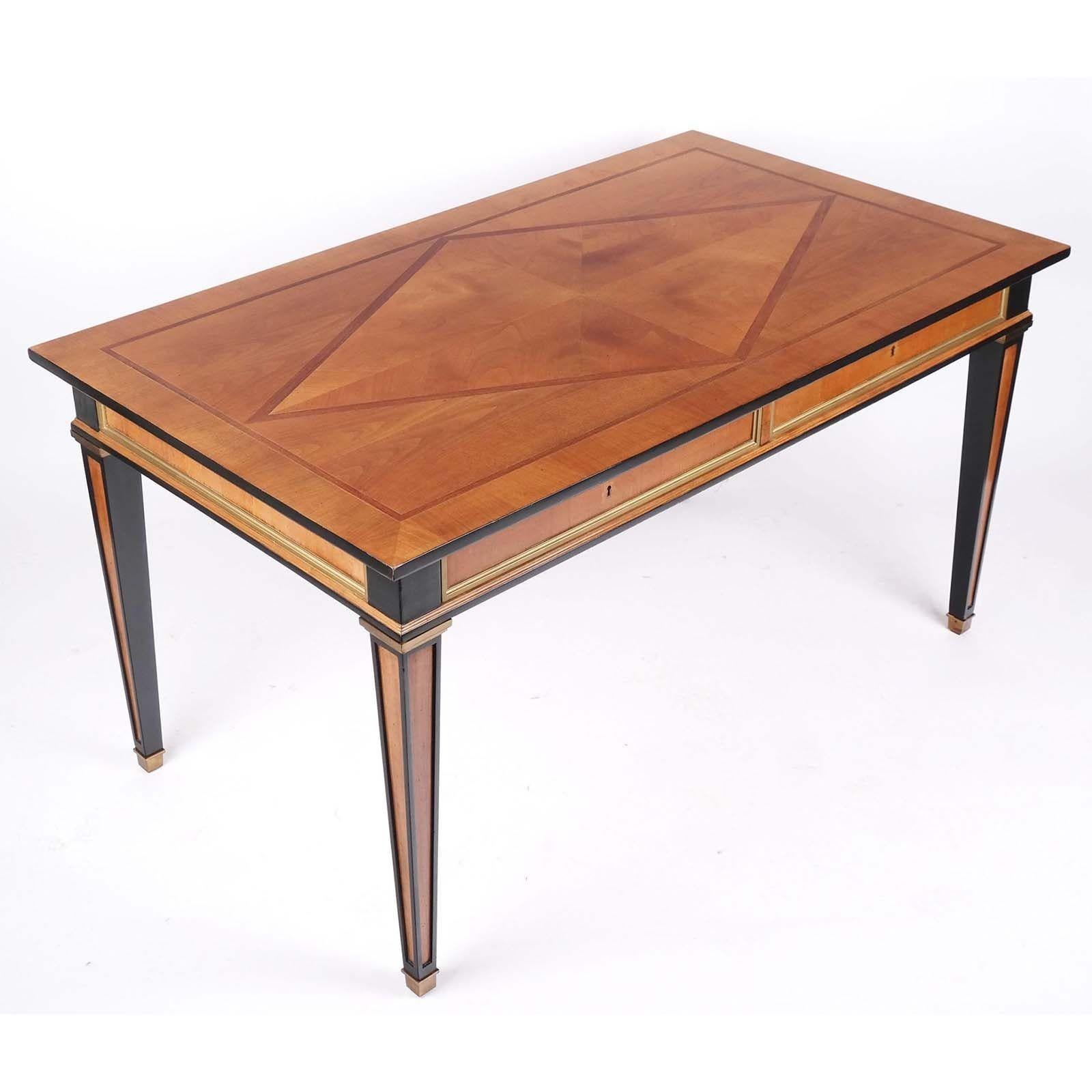 French Neoclassical Empire-Style parcel ebonized desk with maple and mahogany parquetry top.