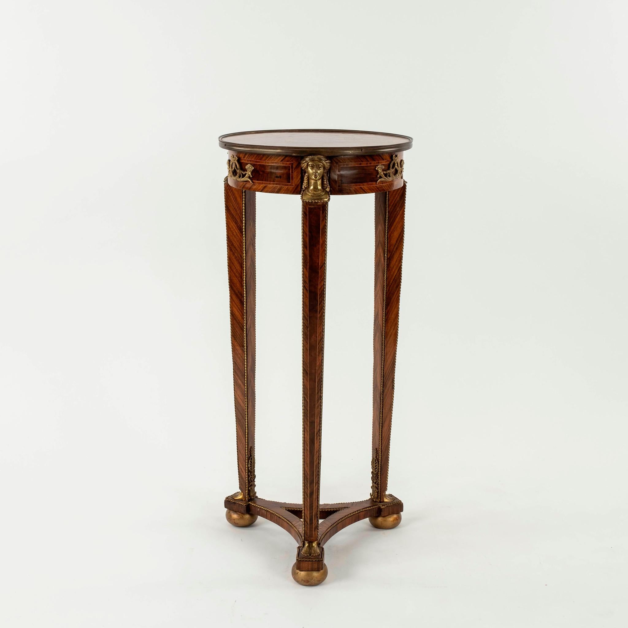 An early 20th century Empire style table stand with single drawer, lovely inlay veneers, caryatid and feet ormolu.
 