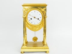 Empire-style pendulum clock made of fire-gilded bronze