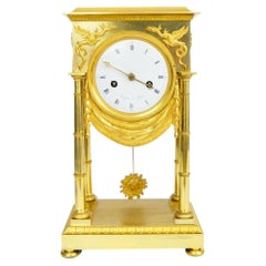 Empire-style pendulum clock made of fire-gilded bronze