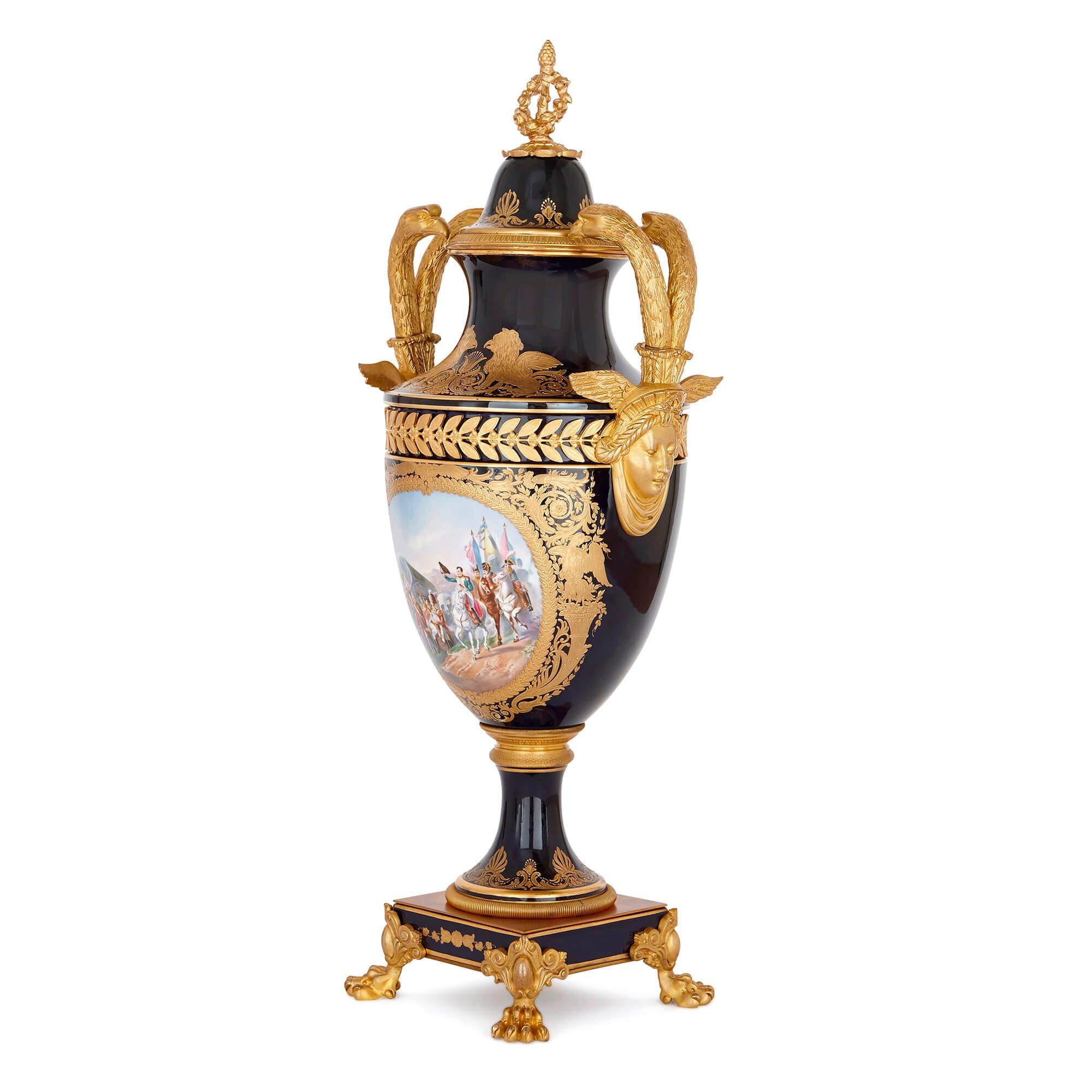 This Sevres style porcelain vase is beautifully painted with an image of Napoleon I on horseback. In this painting, Napoleon visits his men, some of whom are wounded, in what appears to be a military camp. He is seen, leading a group of mounted