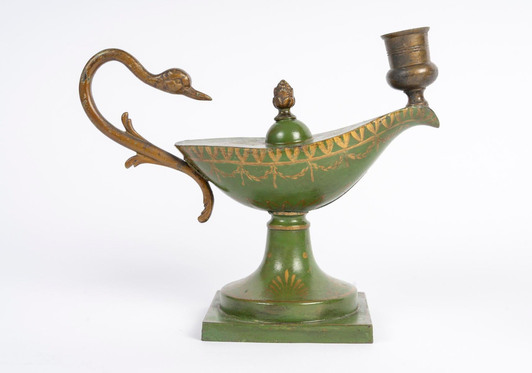 Desk set comprising an Empire style candlestick and cup in painted sheet metal, Napoleon III period, 19th century.

Cup: H: 16cm, W: 10cm, D: 10cm
Candlestick: H: 19cm, W: 24cm, D: 10cm