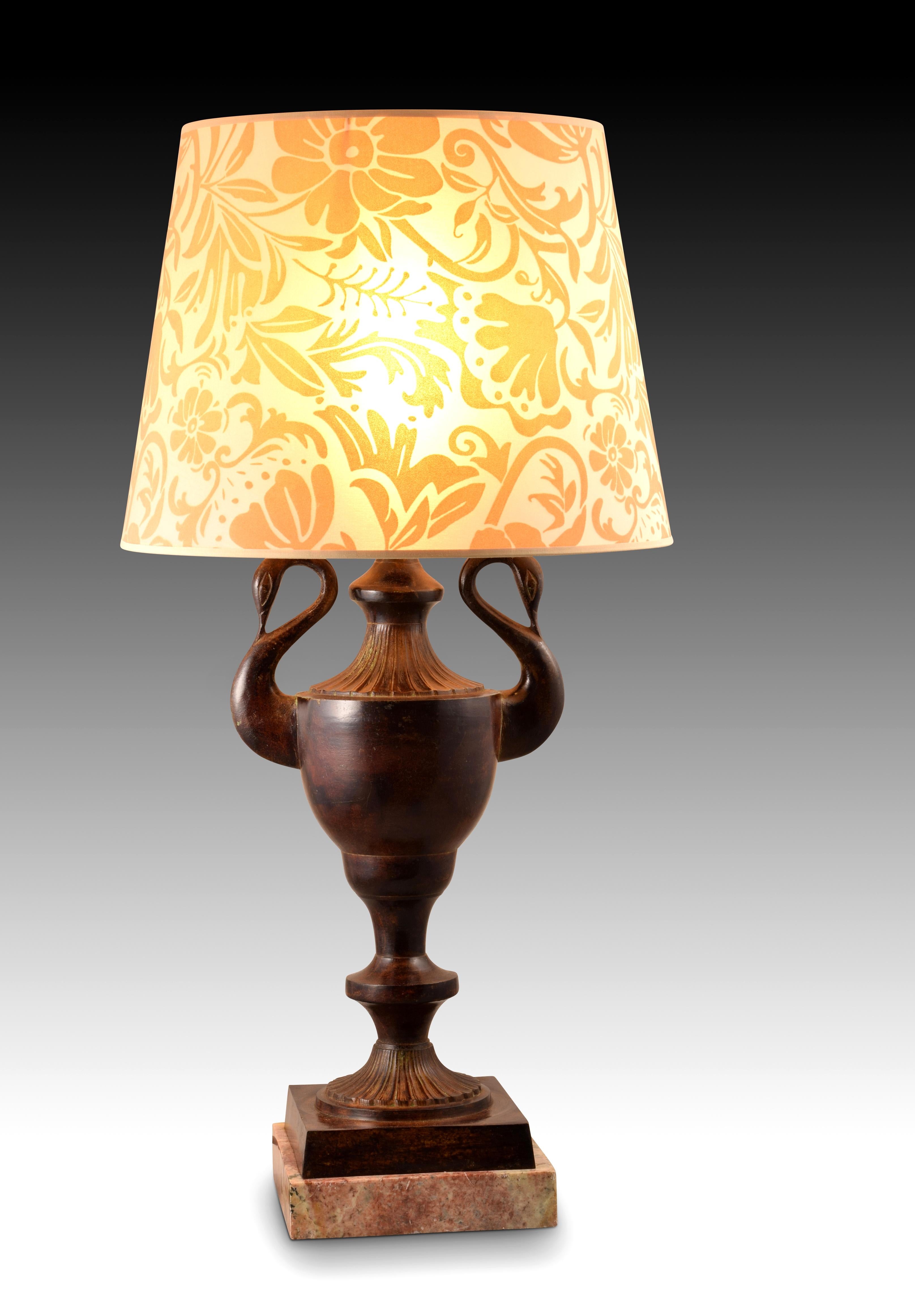 Empire style lamp (without shade).
 Patinated bronze. marble base Table lamp raised on a marble base, has a vase shape with simplified swan head handles, following examples from the 19th century.