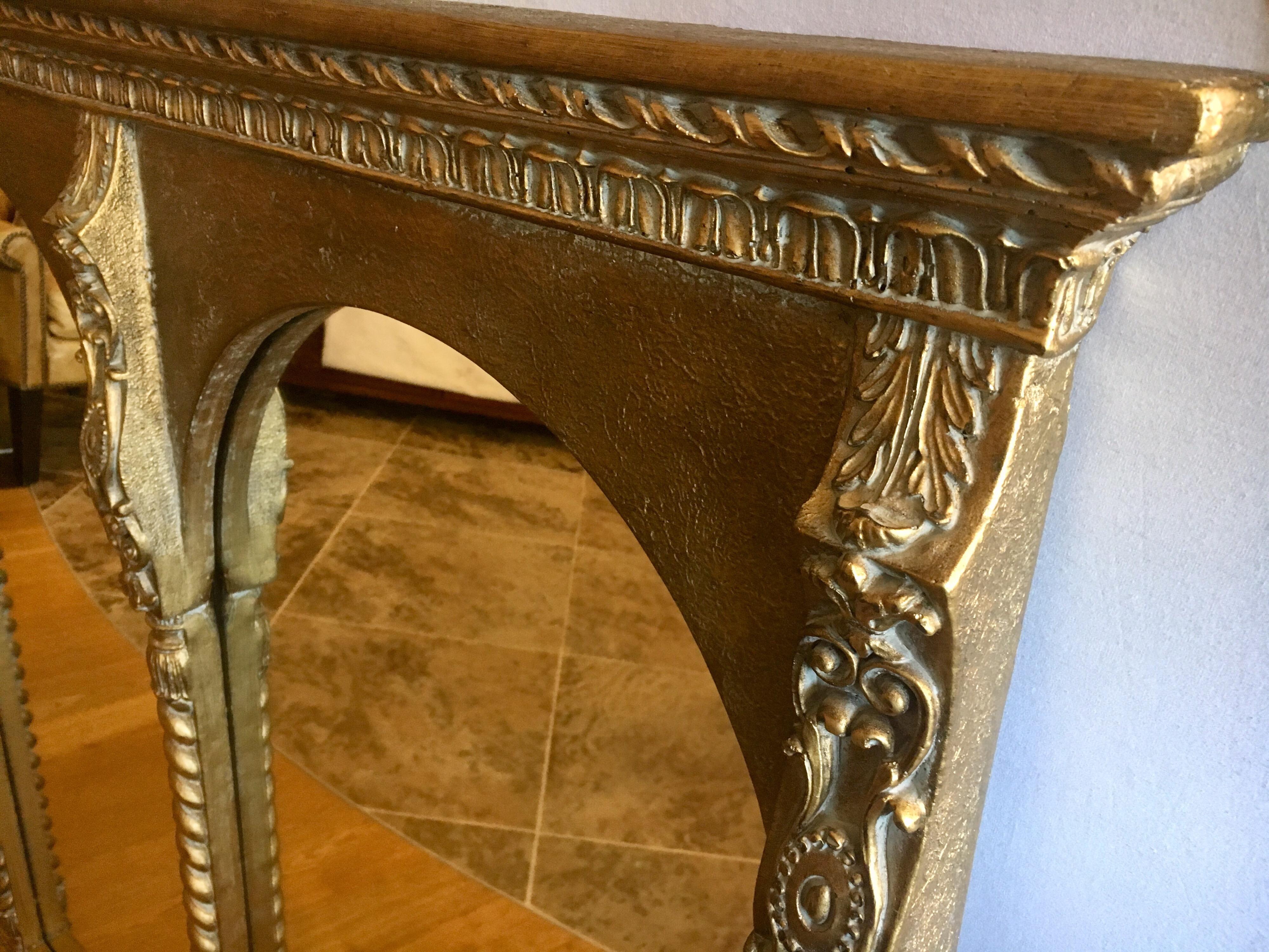 Empire style gilt composite triptych mirror for over the mantel. Made of composite and wood with triple mirror framed at front. Quite gorgeous.