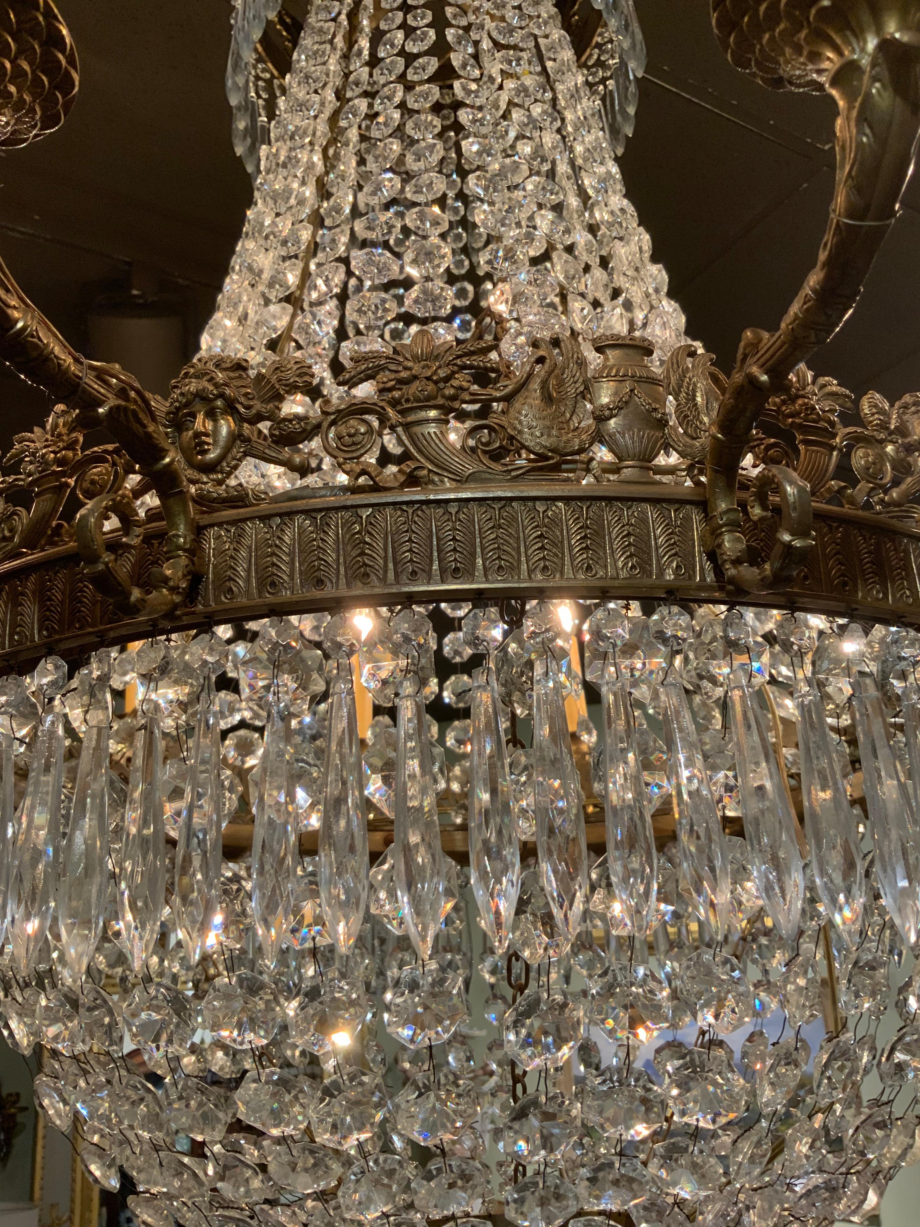 Empire style twelve light crystal and bronze antique chandelier  In Excellent Condition For Sale In Houston, TX