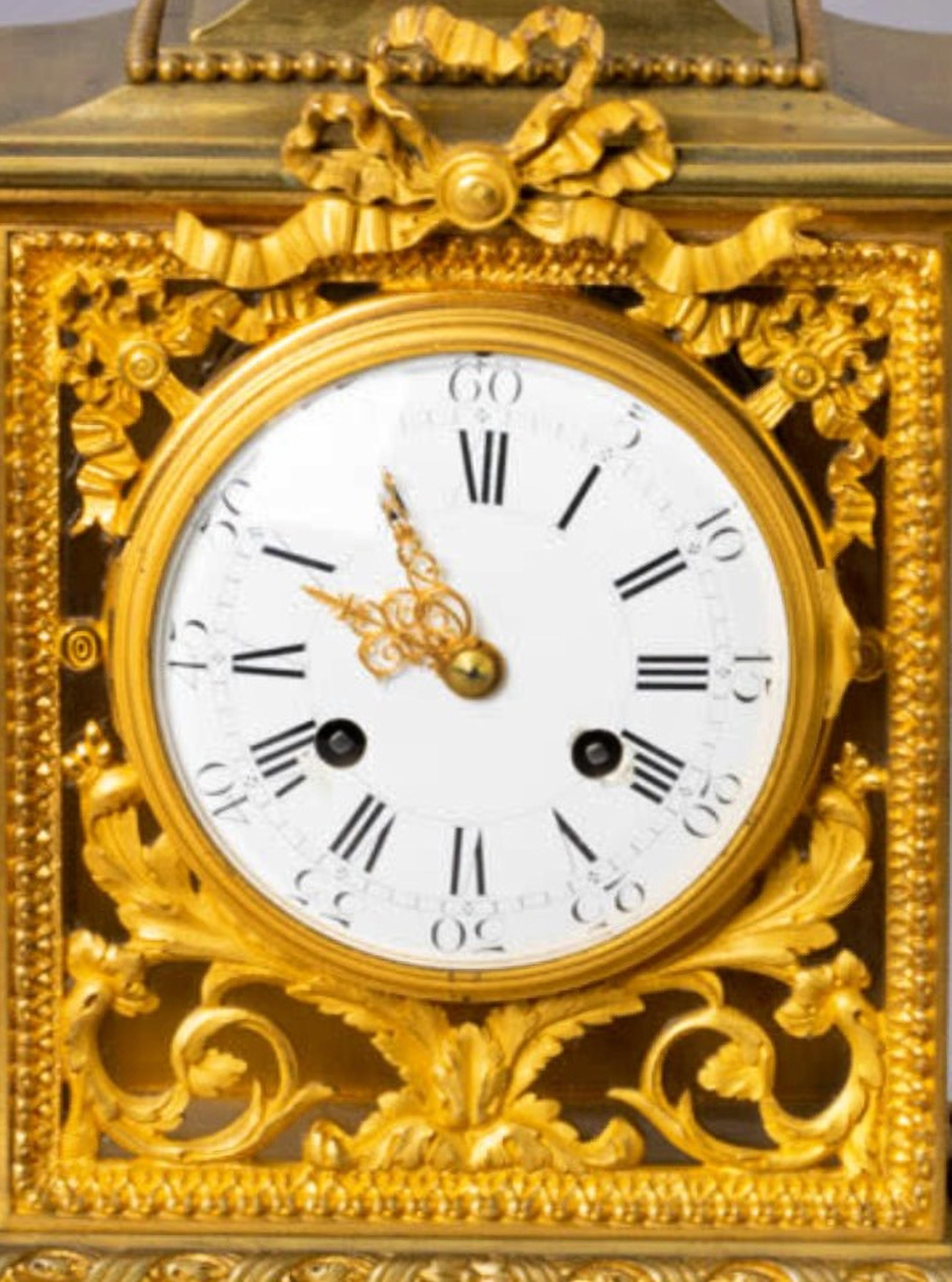 EMPIRE TABLE CLOCK Napoleon III 19th Century
In gilt bronze, relief and pierced decoration with plant elements, topped by a cup. 
Enamel dial with Roman numerals.
Marked. French,
good conditions
Dim.: 44,5x28x15 cm.