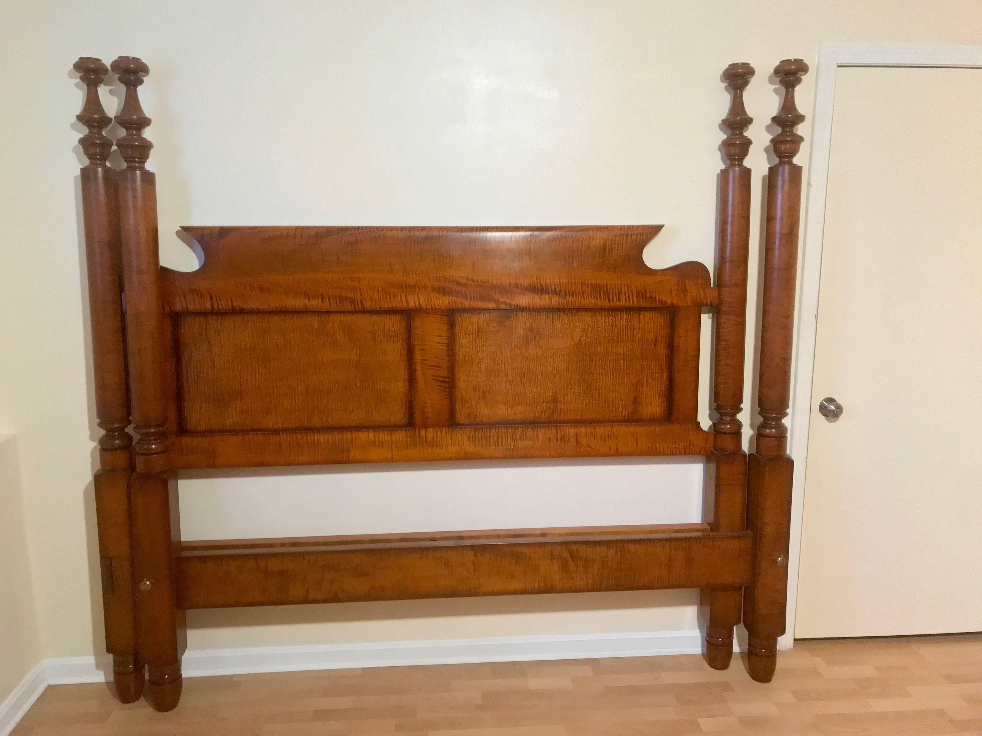 Outstanding Empire tall post bed in tiger maple, circa 1840 refitted to a standard king with two panel bend back head board. Original 3/4 bed was purchased from a large estate in Texas. Measure: 2