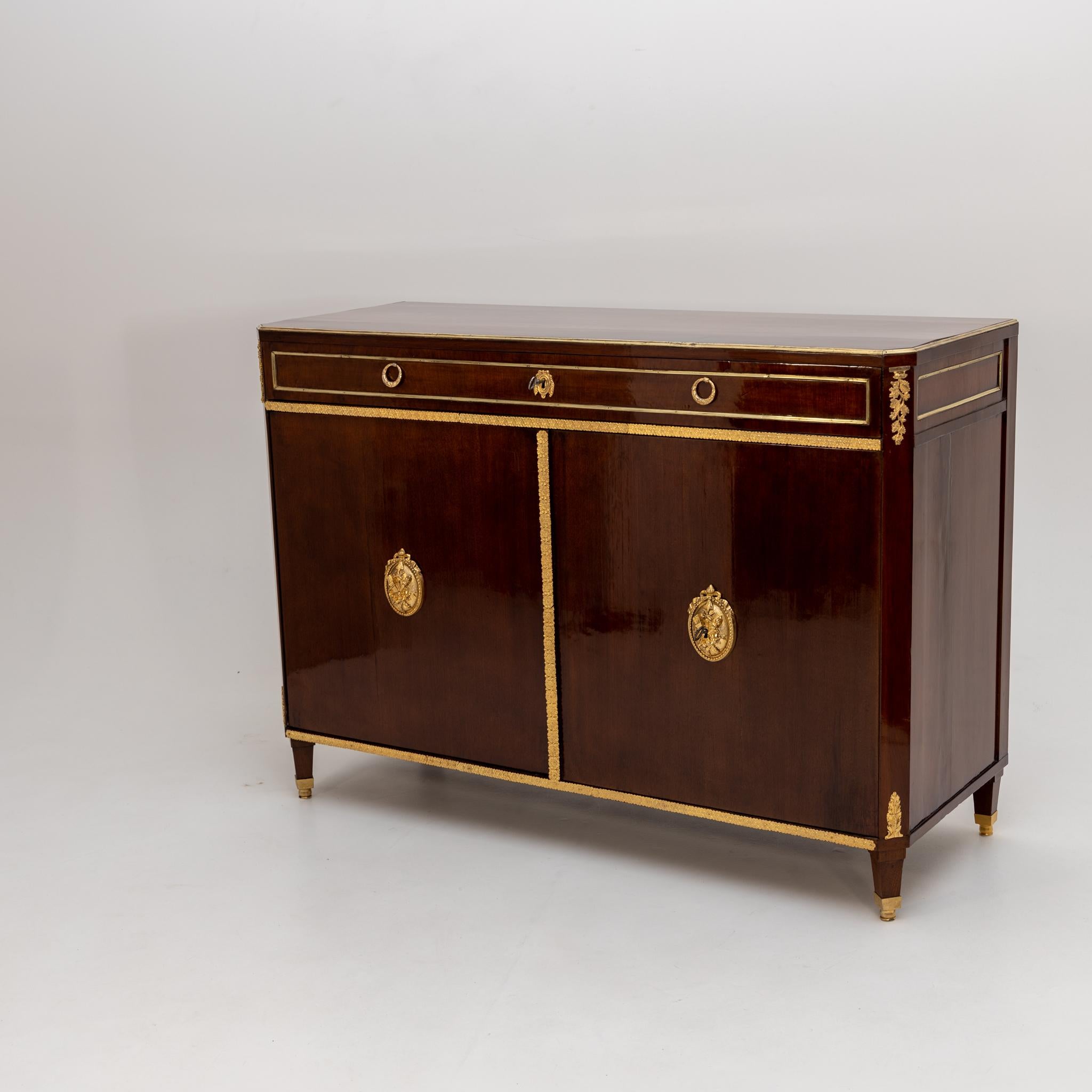 Two-door trumeau cabinet with one wide drawer and fire-gilt bronze fittings.