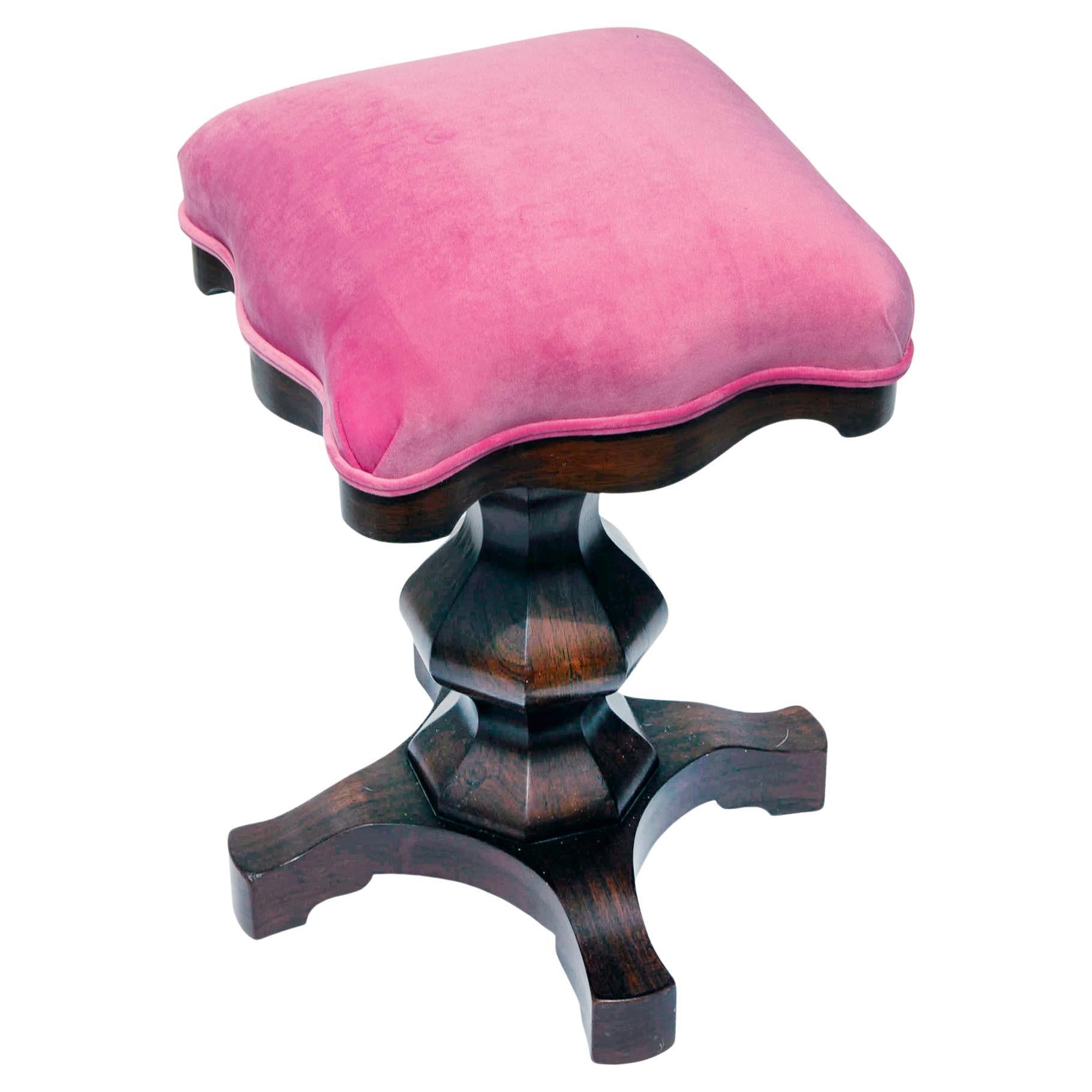 Rare Piano stool with beautiful geometric pedestal base. 
This mechanical chair raises & lowers without a creak. 
A perfectly crafted piece reupholstered in playful raspberry velvet.
This piano stool is in near perfect condition 
14ʺW × 14ʺD × 22ʺH
