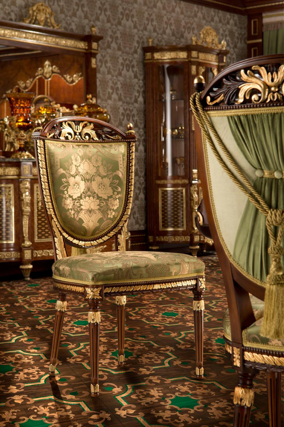 Have a seat on this wonderfully upholstered empire side chair by Modenese Gastone Interiors featuring a wood frame gold leaf applied in details, upholstered with a premium floreal satin fabric in green. What's more? A wonderfully designed fabric