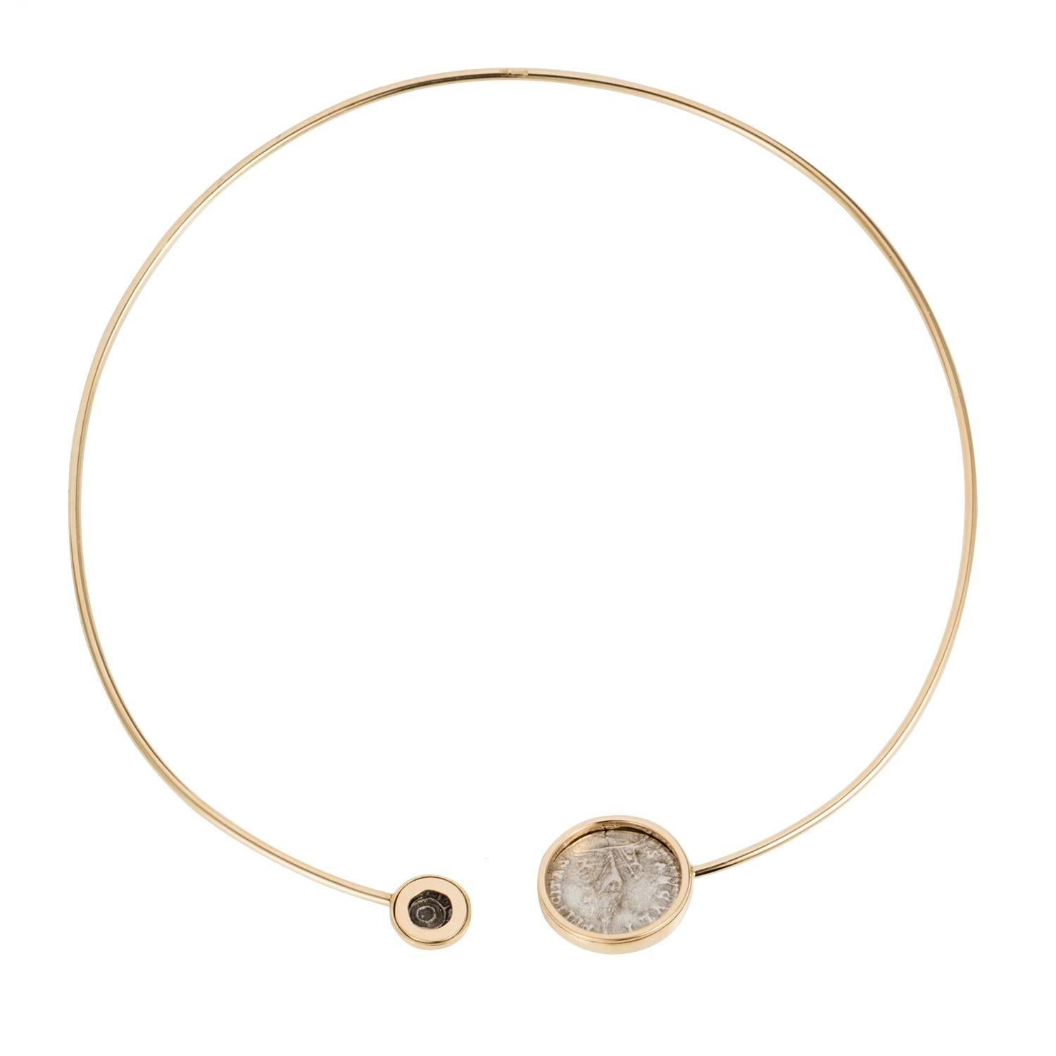 This DUBINI coin choker from the 'Empires' collection features an authentic silver Roman Imperial coin  and an authentic silver Persepolis coin minted circa 1st Century B.C. set in 18K yellow gold. 

* Due to the unique process of hand carving coins