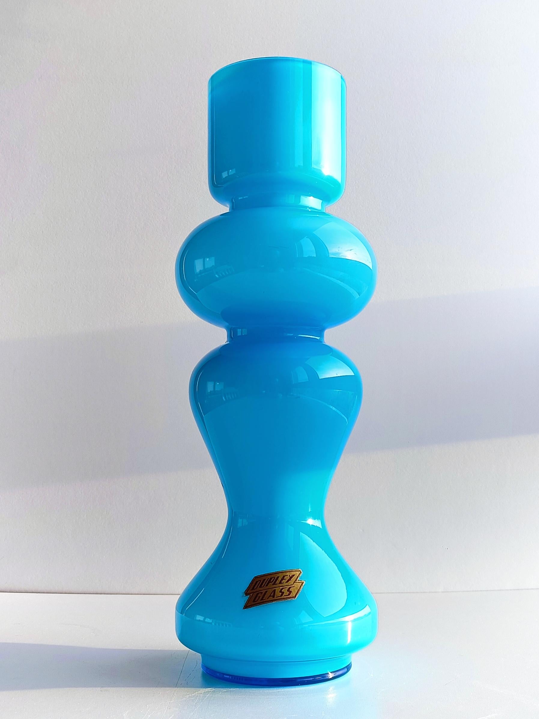 Empoli Scandinavian style Carnaby hooped vase featuring a beautiful turquoise blue cased glass. The Carnaby style vases were a trend set by designer Per Lütken at the famous Danish glass company Holmegaard, circa the 1960s. This collection of