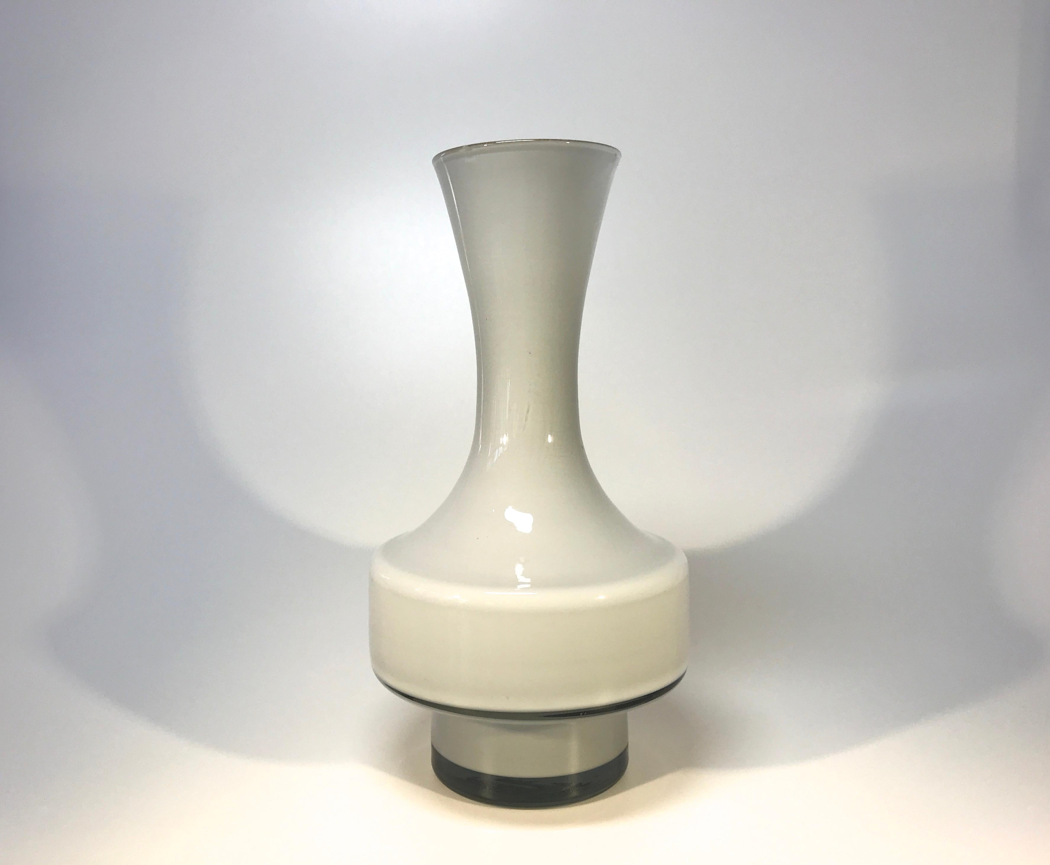 Understated soft dove grey shaped glass vase from vintage Empoli, Italy.
A very retro styled piece - with a 'nod' to Scandinavian design
circa 1960s-1970s
Measures: Height 7.5 inch, diameter 4 inch
In very good condition.
