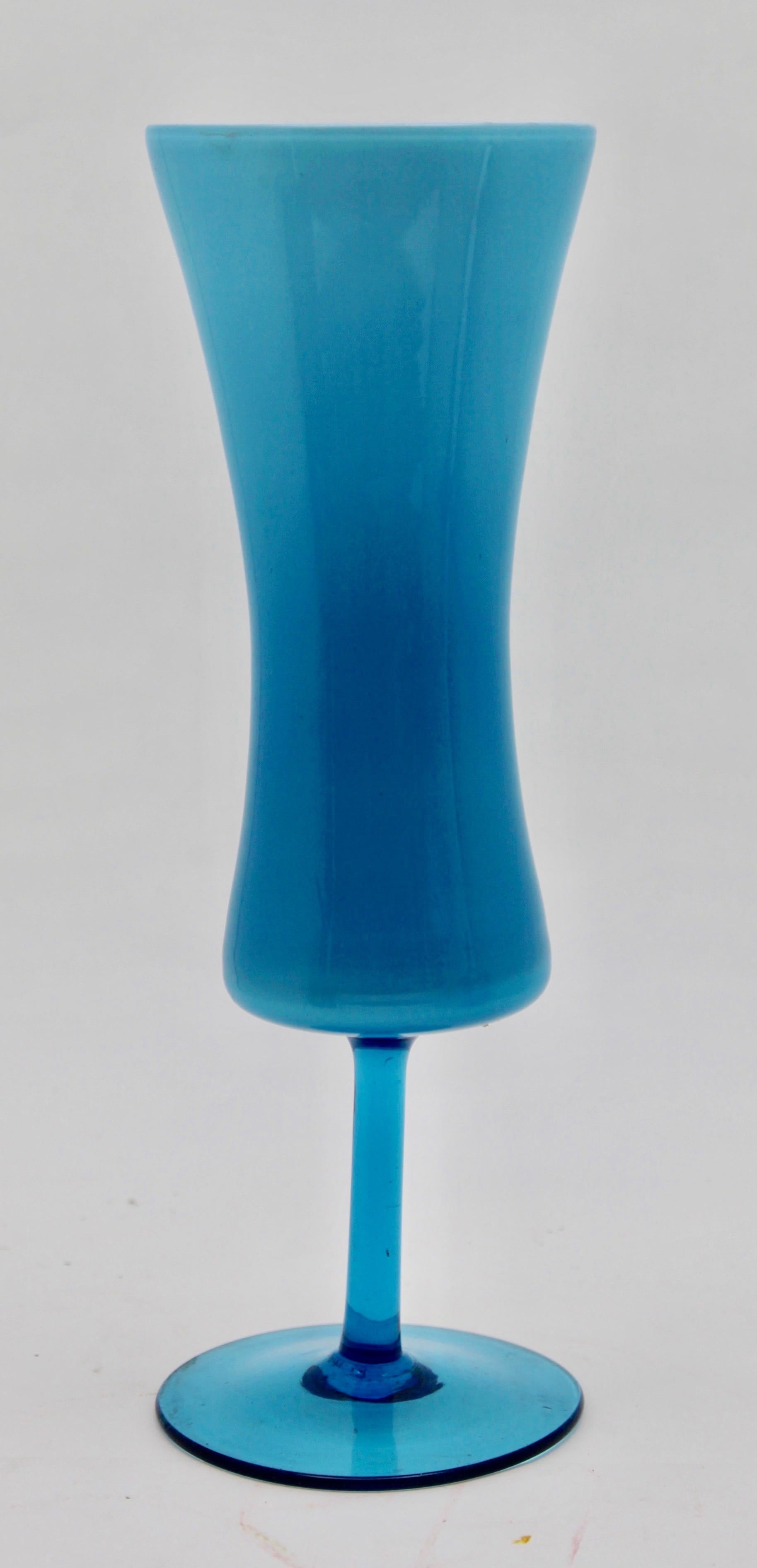 This blue-themed grouping shows a range of typical decors from the glass factories of Florence, Italy, collectively known as Empoli.
All these vases have an inner layer of opaque, white glass

Two vases in light blue opaline
Cognac glass in