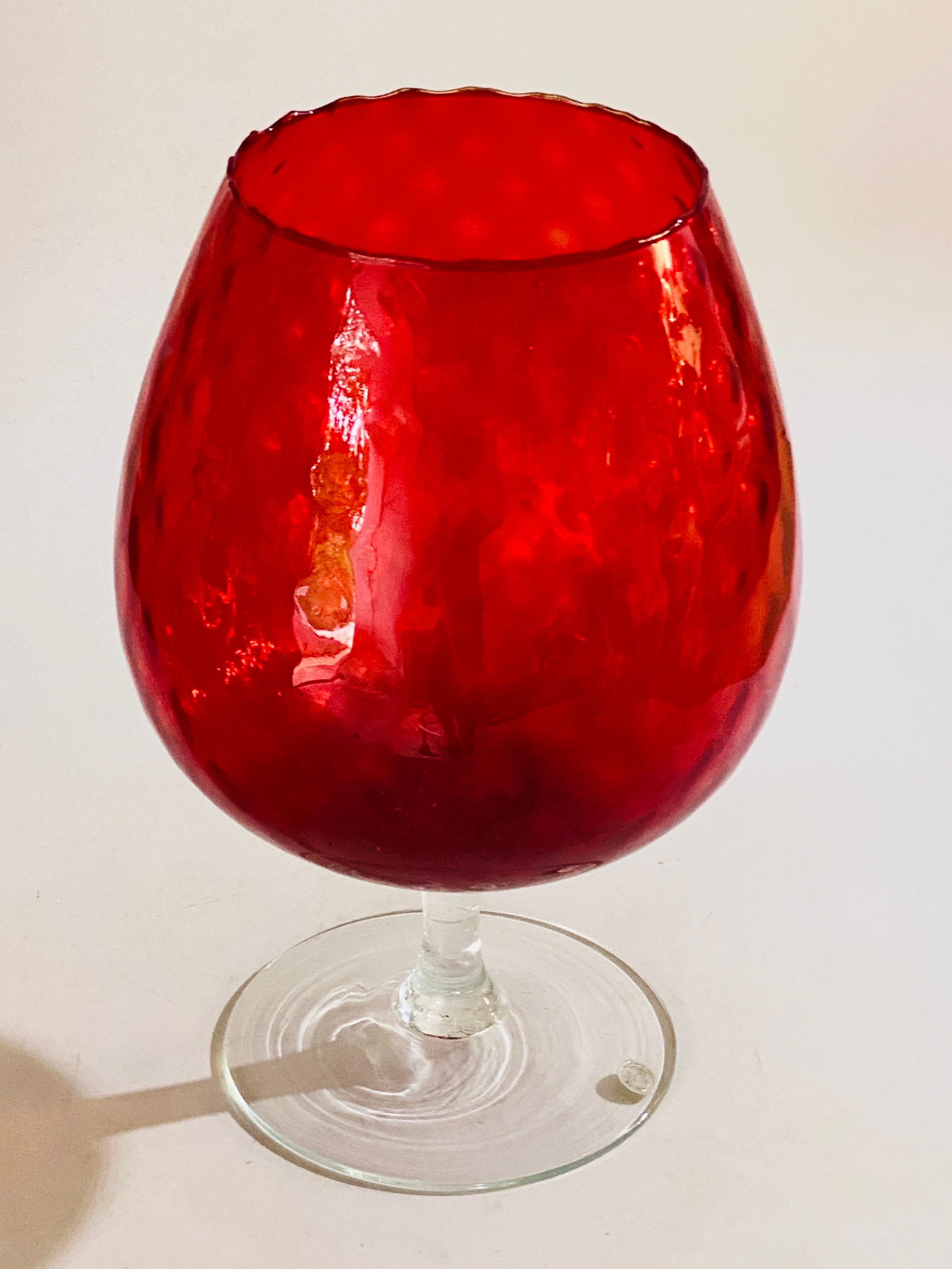 This is a genuine Empoli art glass large vase, with the stick used by Emploli, whiten made in Italy. This is a Murano glass, the vase is heavy and large, and in a perfect condition. The color in Red, 
The sten of the vase is in transparent glass.