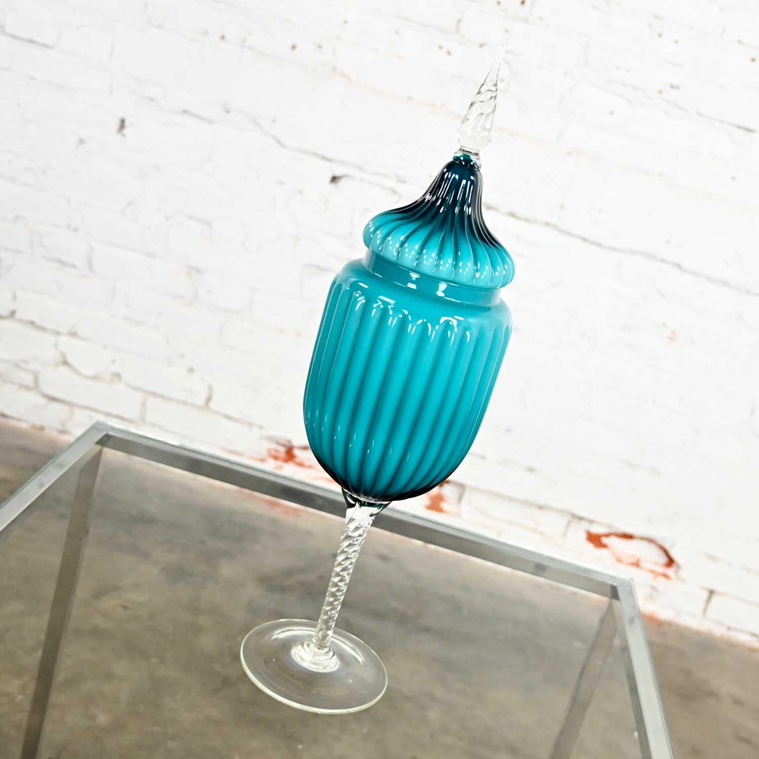 Gorgeous Empoli Italian cased glass lidded compote circus tent jar in peacock blue. Beautiful condition, keeping in mind that this is vintage and not new so will have signs of use and wear. No chips, cracks, or chiggers that we have detected. Please