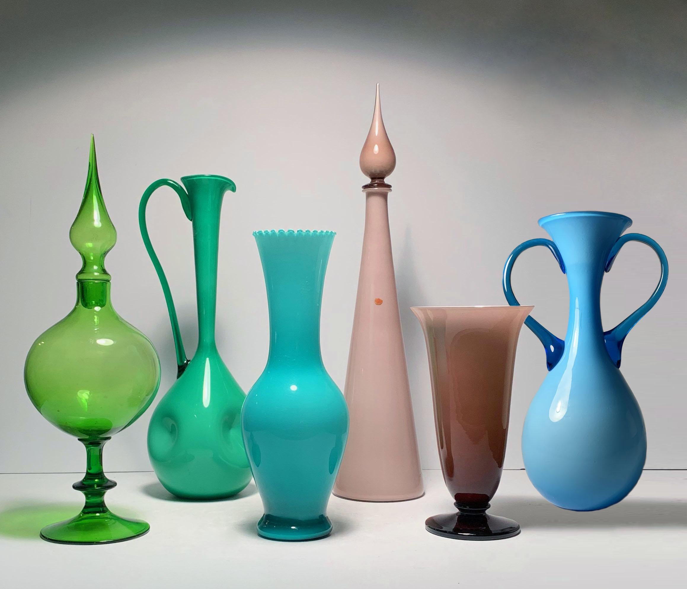 5 large pieces. A eclectic collection in a nice blend of colors.

Dimension listed is for the large Green ewer pitcher with handle.

 