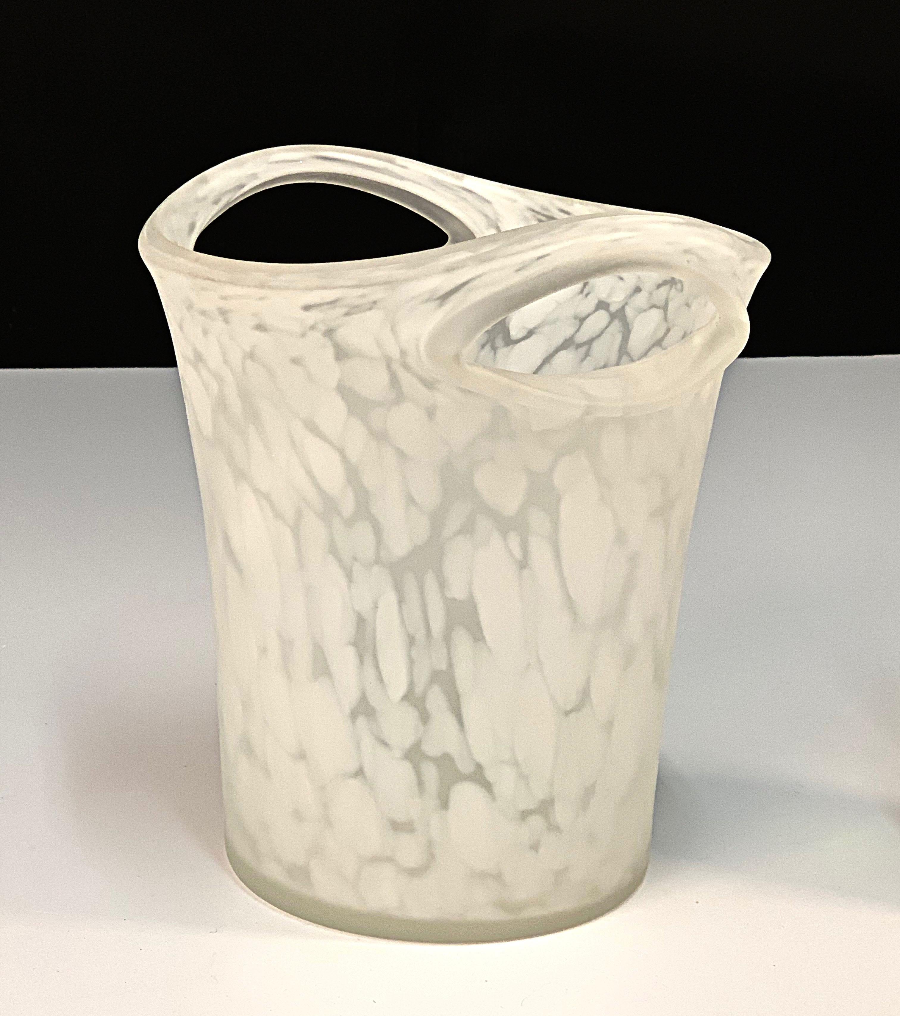 Exceptional midcentury Italian glass champagne or wine cooler ice bucket. 

This item is made of mouth-blown milky glass and it was produced by the manufacturer Empoli in Italy during the 1960s.

An amazing production with pierced glass handles,