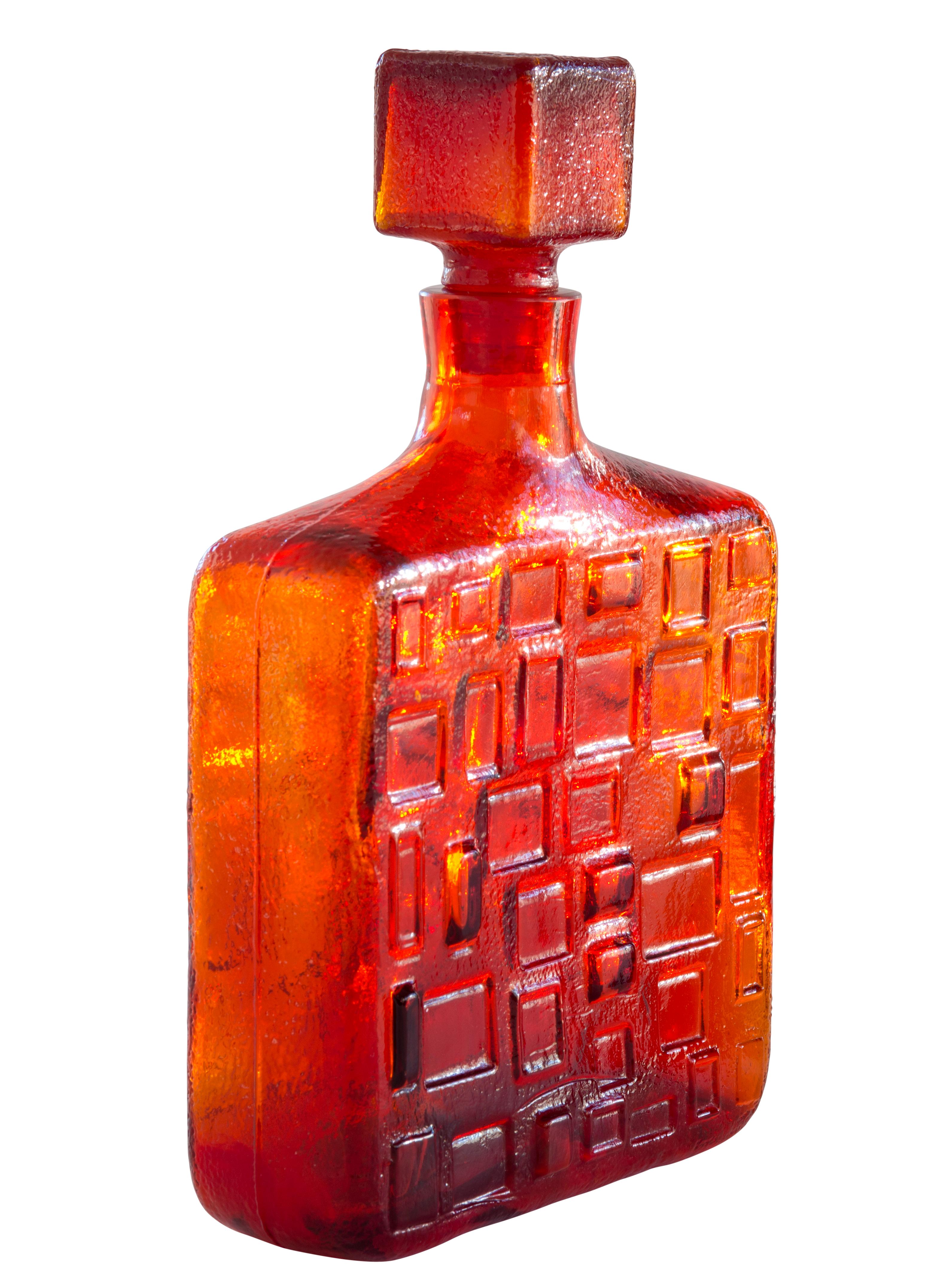 Empoli pressed glass decanter in vibrant fire orange, made in Italy, circa 1960. 

The Empoli region, on the west side of Italy, has been producing and exporting glass since the 14th century.