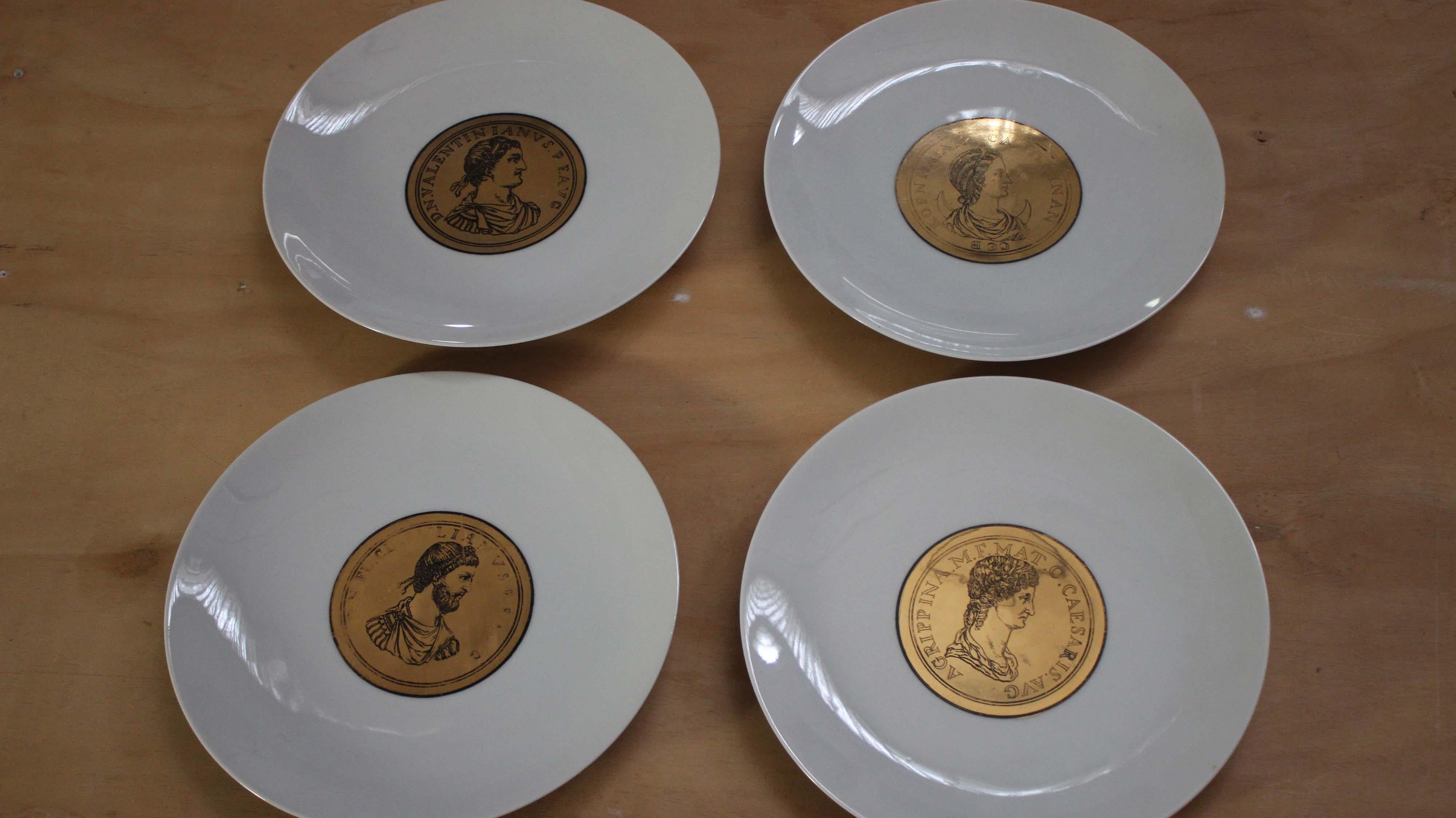 Atelier Fornasetti
Rare set of 4 plates with Emperor profiles printed on round gilded medals. Signed by Atelier Fornasetti,made in Italy in the 1940s.