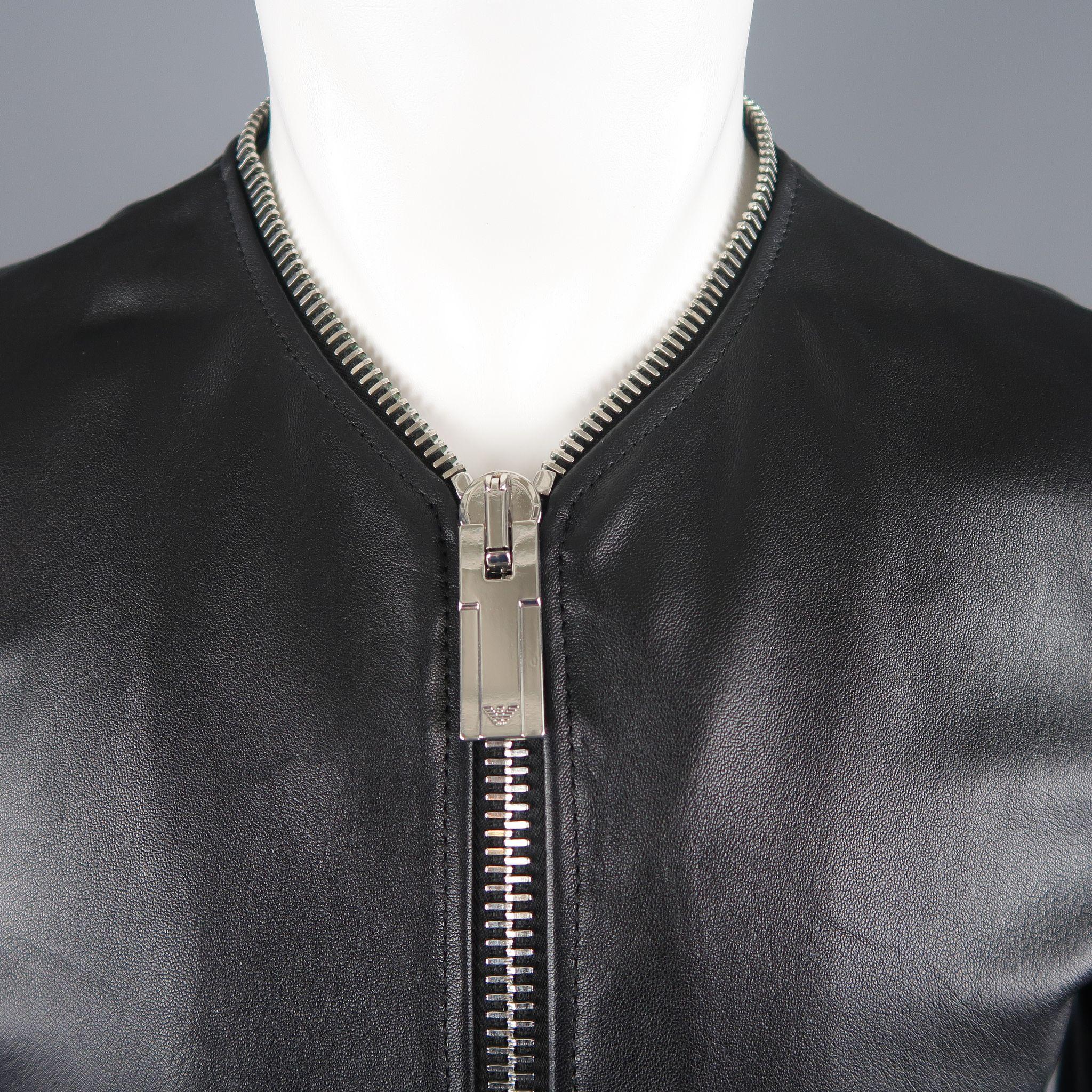 EMPORIO ARMANI jacket comes in black lambskin leather with a collarless V neckline, oversized double zip front,  zip cuffs, and zipper silver tone piping. Made in Romania.
 
Excellent Pre-Owned Condition.
Marked: IT 48
 
Measurements:
 
Shoulder: 16