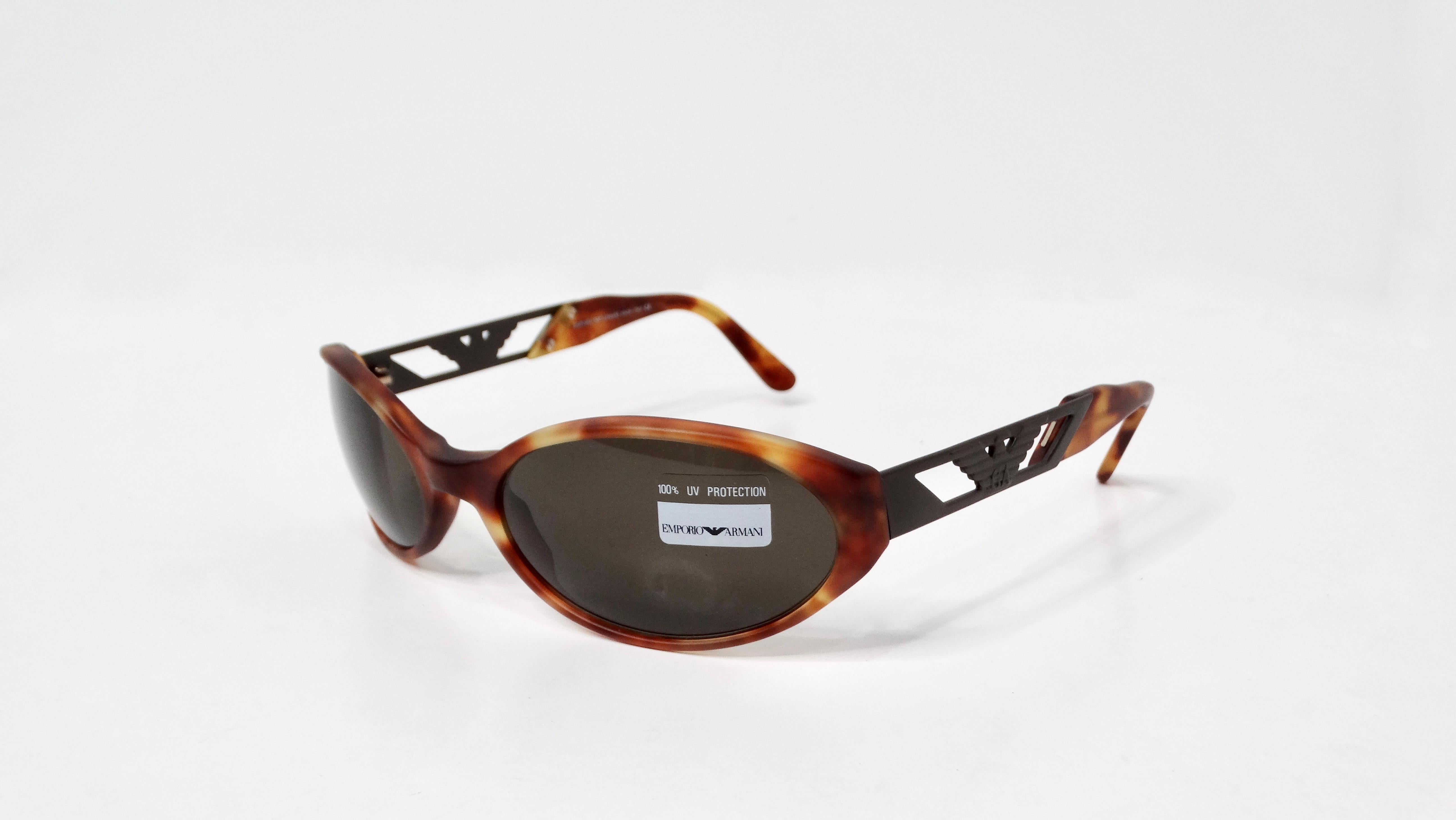 The Emporio Armani 544-S Blond Tortoise Tinted Oval Lens Shield Sunglasses embody a unique blend of contemporary design and classic elegance. Featuring a light tortoise shell color, these sunglasses serve as a versatile accessory that enhances any